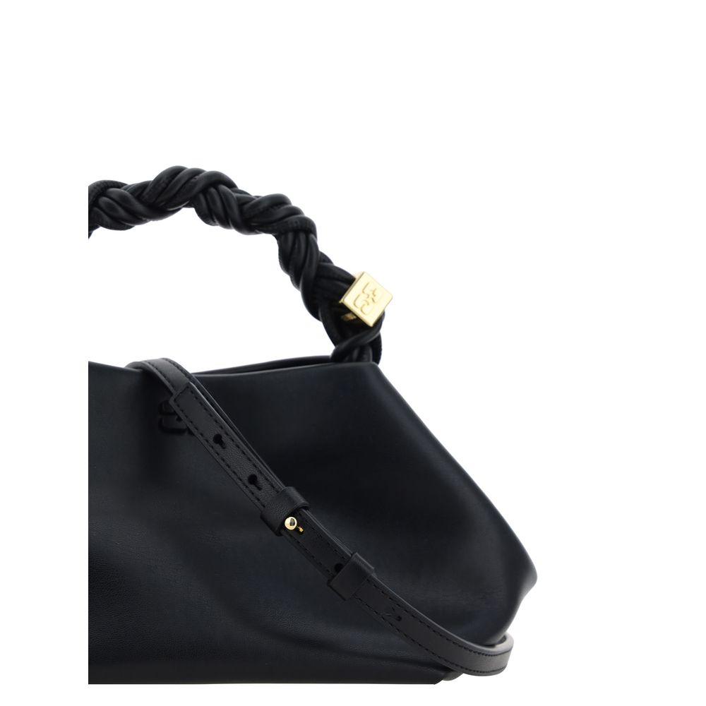 Discover the Ganni Black Calf Leather Bos Taurus Handbag, a luxurious blend of sustainability and style, perfect for the modern connoisseur seeking elegance and individuality.