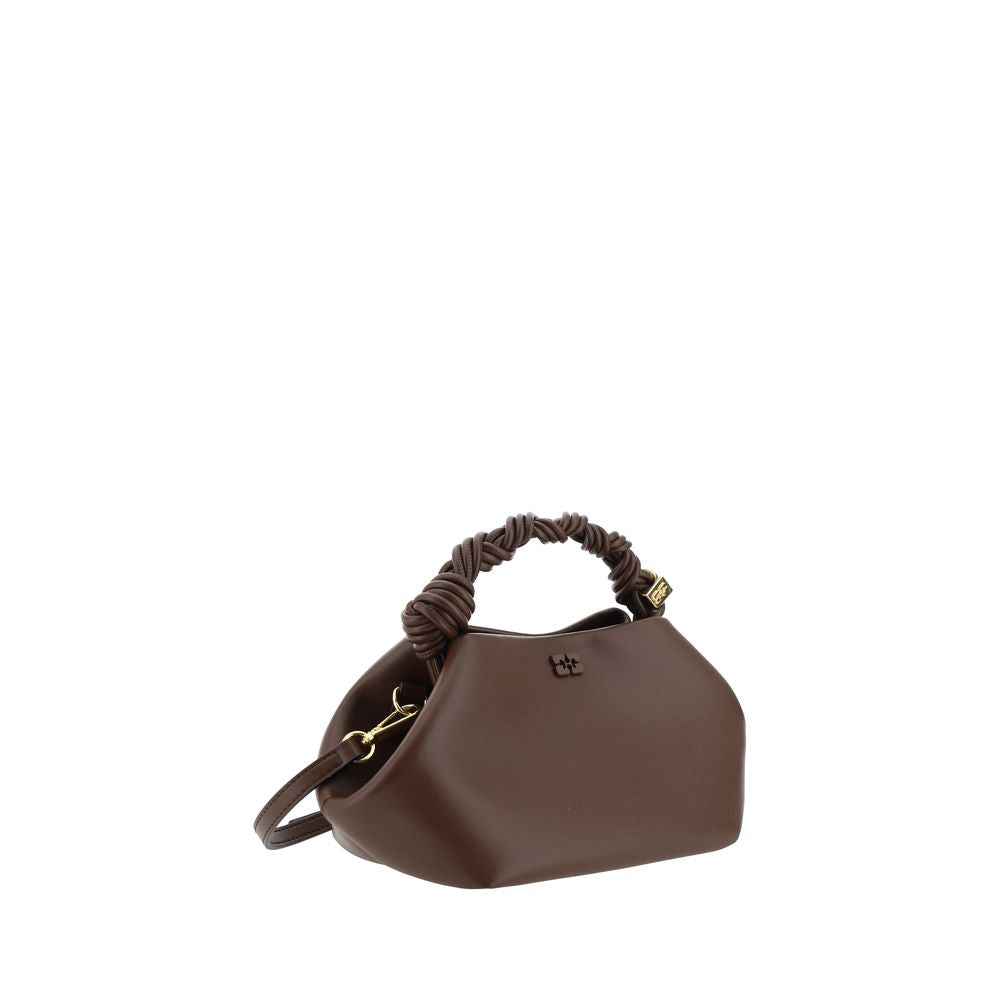 Discover the Ganni Brown Calf Leather Bos Taurus Handbag, a masterpiece of sustainable luxury, blending iconic design with meticulous craftsmanship for the discerning fashion lover.