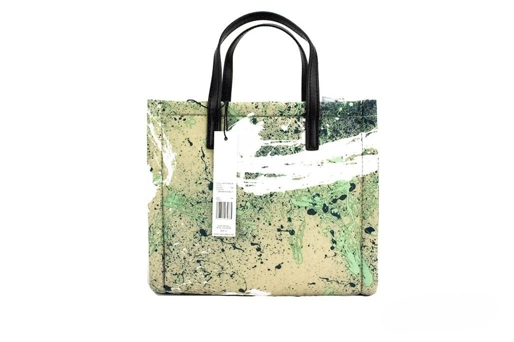 Elevate your style with the Marc Jacobs Mini Green Multi Splatter Paint Print Nylon Crossbody Tote, a luxurious blend of artistry and functionality for the discerning individual.
