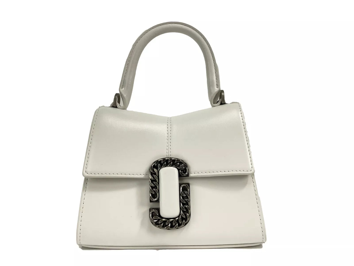 Discover the Marc Jacobs St Marc Mini Top Handle Satchel, a premium leather masterpiece that embodies exquisite craftsmanship and timeless elegance for every occasion.