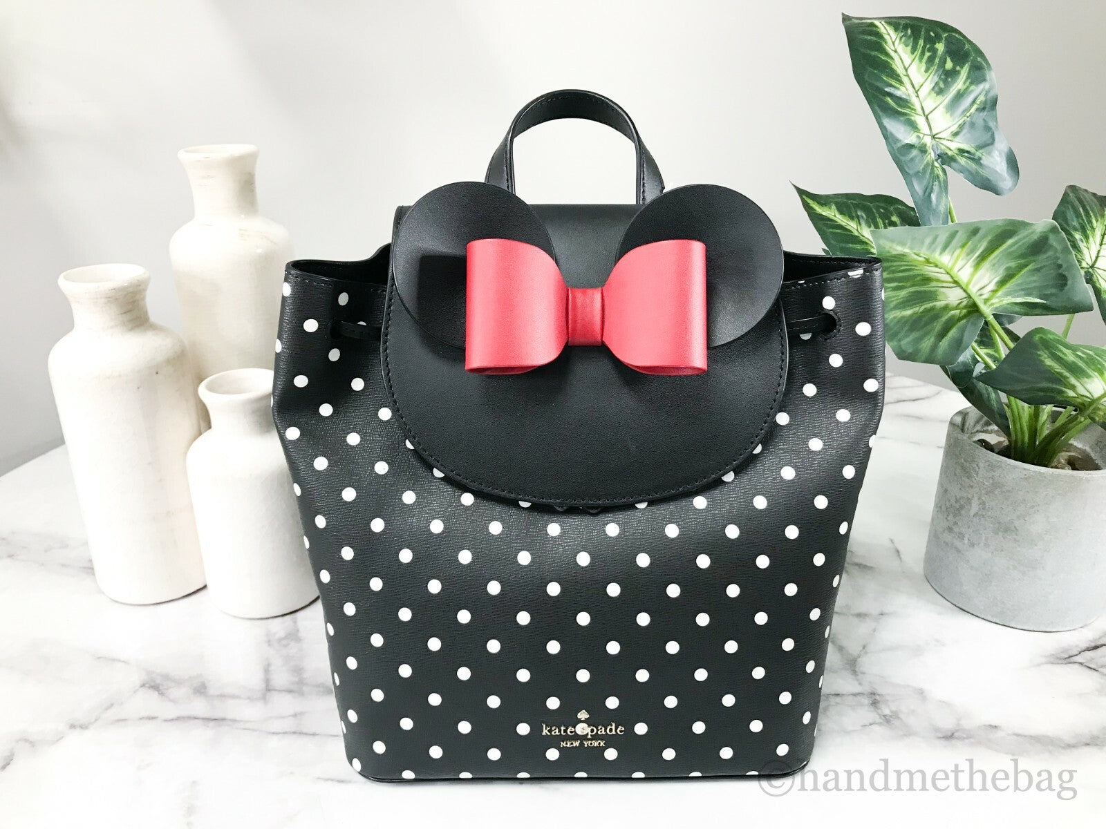 Indulge in the enchanting allure of the Kate Spade Disney Minnie Mouse Medium Leather Backpack, a luxurious blend of refined leather and whimsical design, perfect for the modern connoisseur.