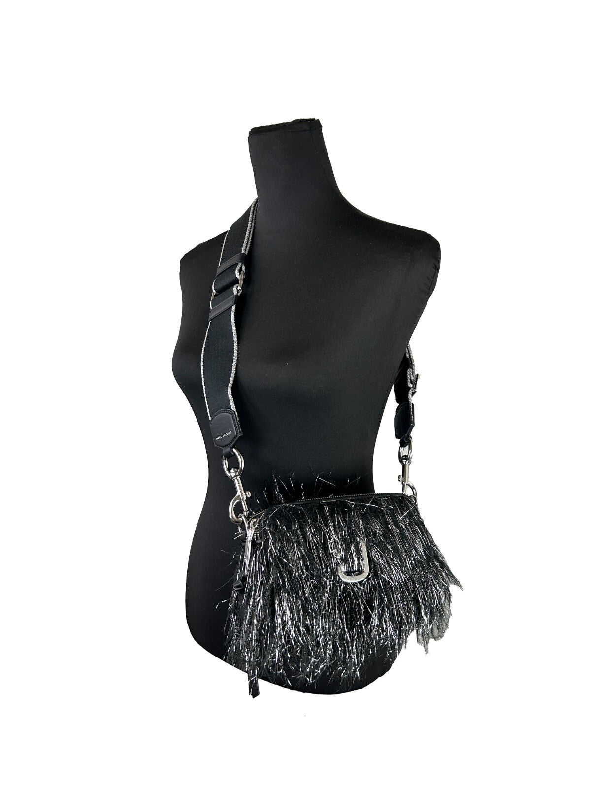 Elevate your style with the Marc Jacobs The Snapshot Creature Crossbody Bag, a luxurious fusion of fur and leather, perfect for any sophisticated occasion.