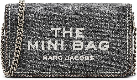 Indulge in the elegance of the Marc Jacobs The Denim Chain Mini Bag, a luxurious blend of soft denim and refined craftsmanship, perfect for every occasion.