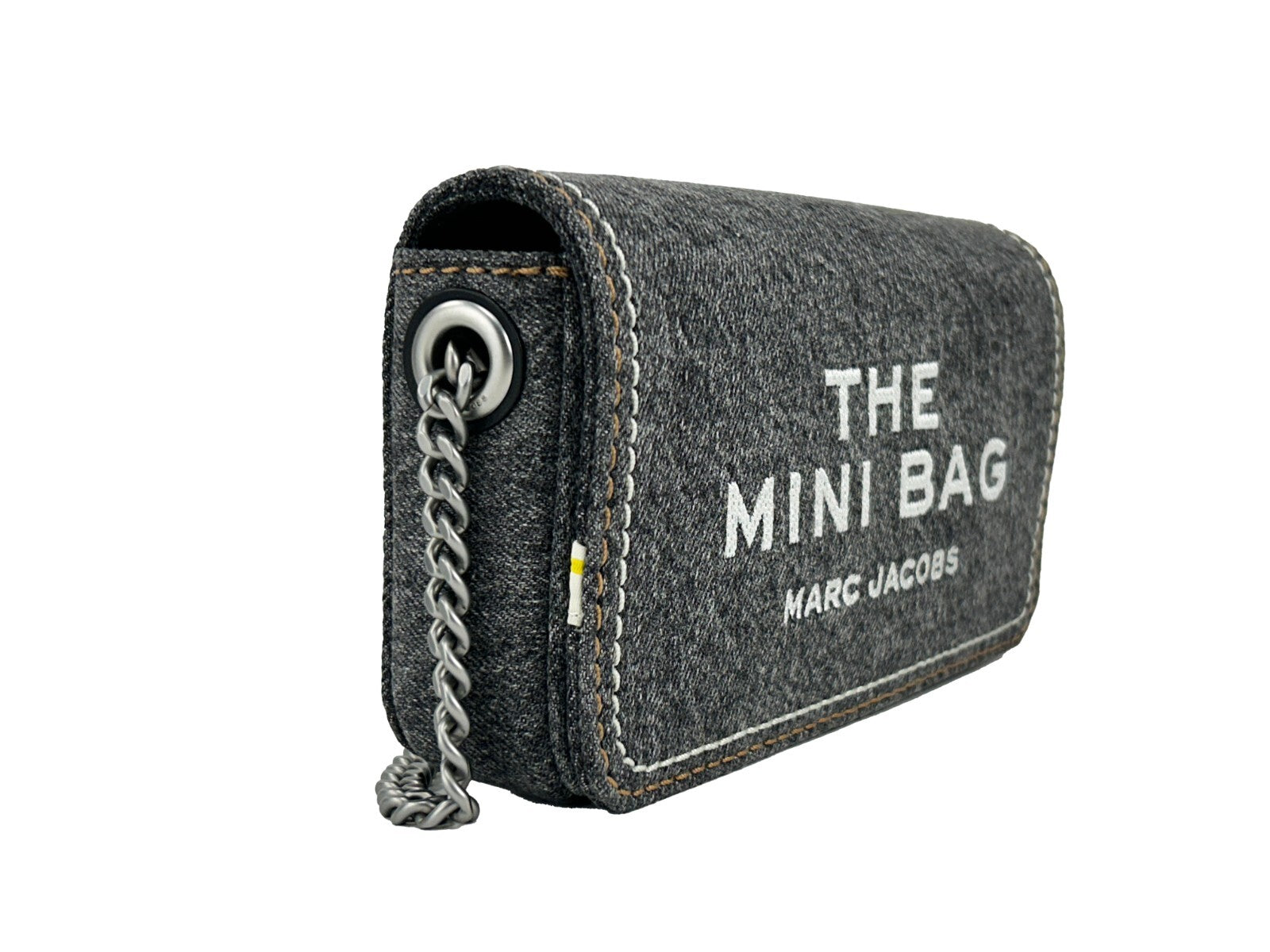 Discover the Marc Jacobs The Denim Chain Mini Bag in Black Wash, where soft denim meets exquisite craftsmanship, embodying timeless elegance for every occasion.