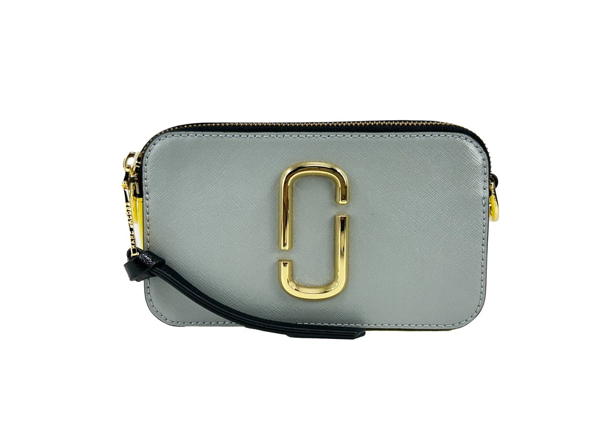Elevate your style with the Marc Jacobs The Snapshot New York Crossbody Bag, a luxurious blend of premium leather and exquisite craftsmanship, perfect for any occasion.