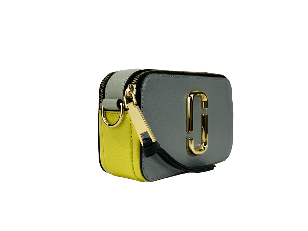 Elevate your style with the Marc Jacobs The Snapshot New York Crossbody Bag, a luxurious blend of premium leather and exquisite craftsmanship, perfect for any occasion.