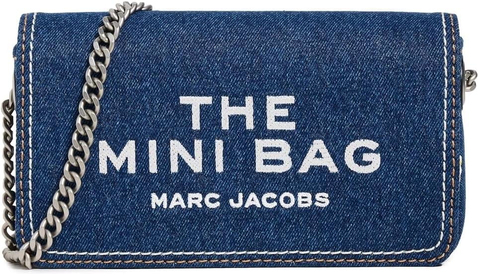 Discover the Marc Jacobs The Denim Chain Mini Bag, a luxurious blend of high-quality denim and exquisite craftsmanship, perfect for elevating any ensemble with effortless sophistication.