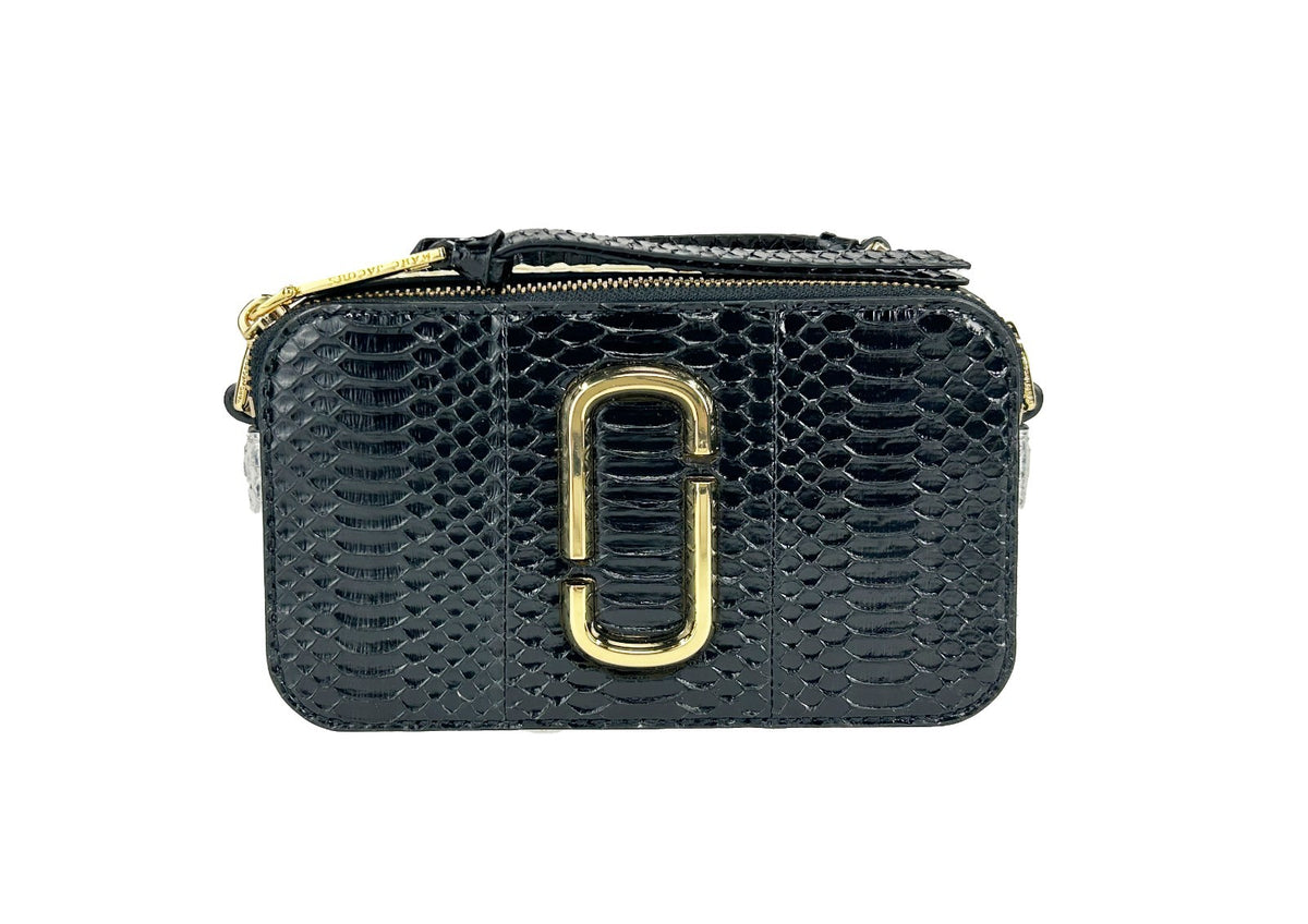 Elevate your style with the Marc Jacobs The Snapshot Snake Skin Crossbody Bag, a luxurious blend of high-quality calfskin leather and exquisite craftsmanship, perfect for any occasion.