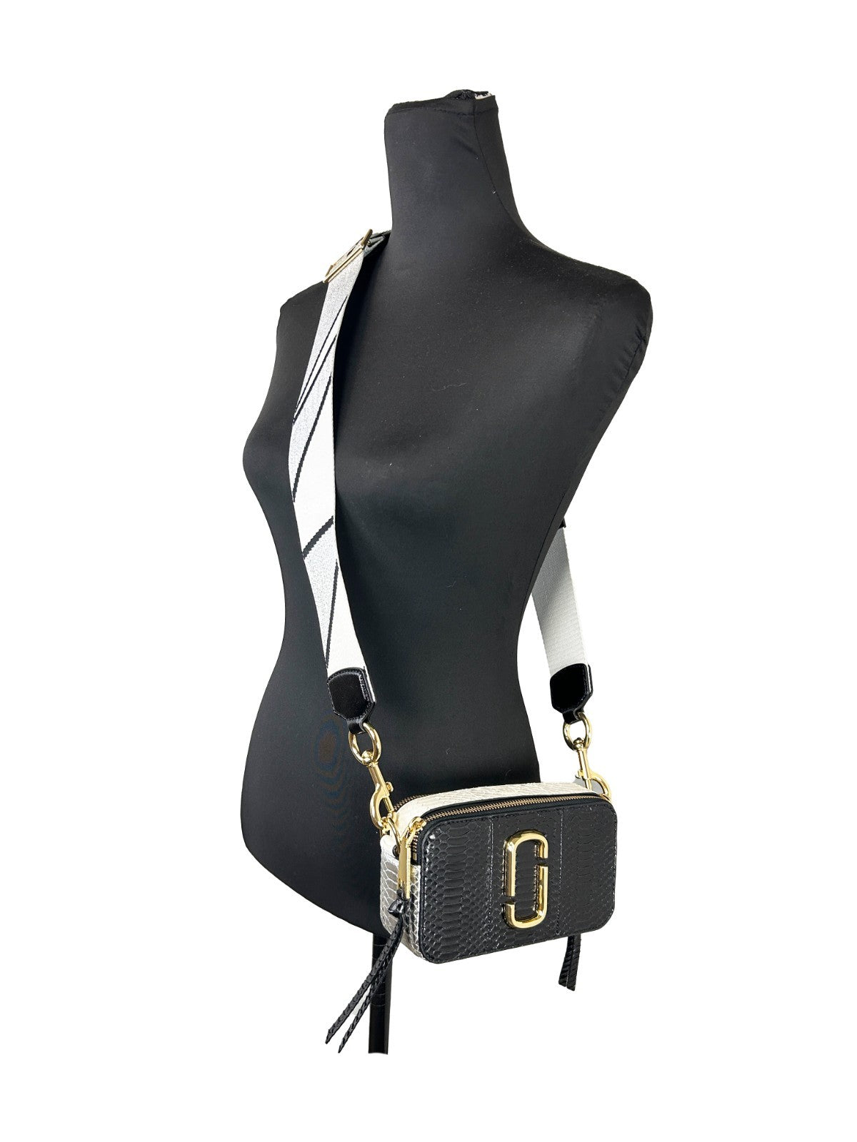 Indulge in the exquisite allure of Marc Jacobs The Snapshot Snake Skin Crossbody Bag, crafted from luxurious calfskin leather, embodying modern elegance and sophistication.