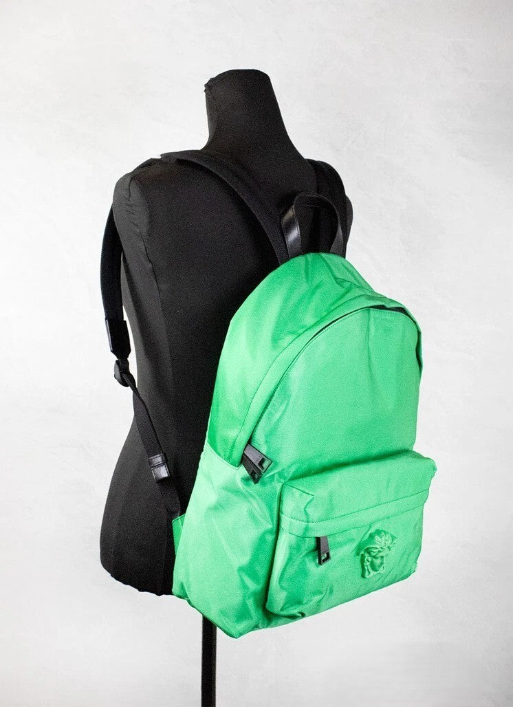 Elevate your style with the Versace Large Bright Green Nylon Fabric Medusa Shoulder Backpack, a fusion of luxury and functionality designed for the discerning individual.