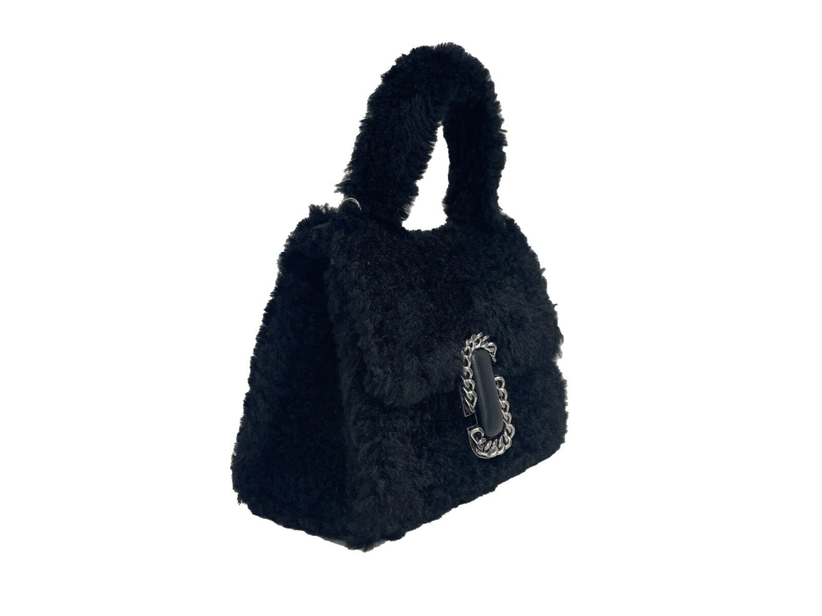 Elevate your style with the Marc Jacobs St Marc Mini Top Handle Satchel, a luxurious fur masterpiece that embodies sophistication and timeless elegance for every occasion.
