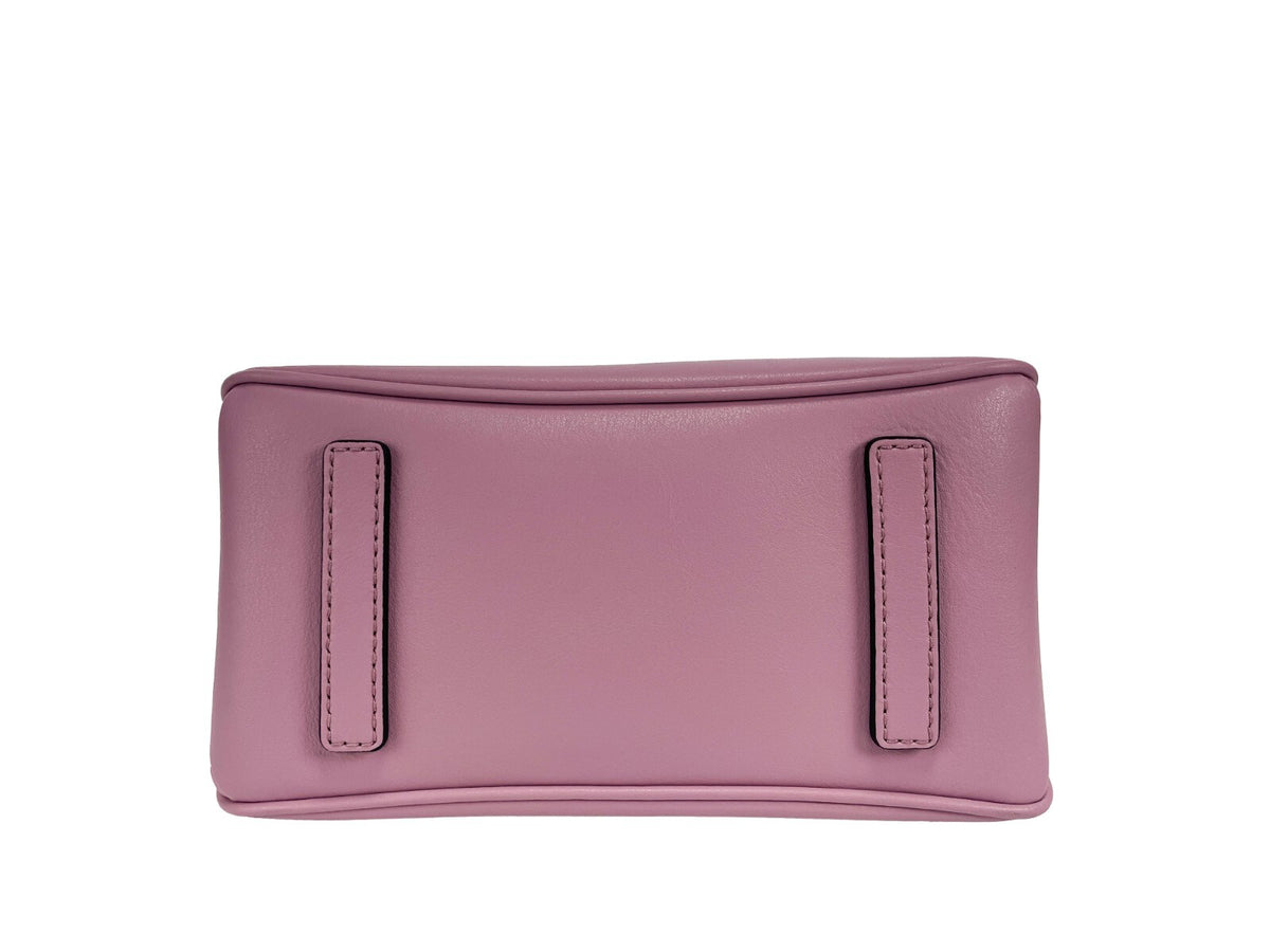 Indulge in the exquisite allure of Marc Jacobs The J Marc Mini Chain Satchel Bag, a luxurious leather masterpiece that elevates every ensemble with its sophisticated charm.