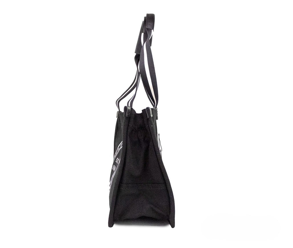 Discover the Marc Jacobs Medium Black Canvas Tote, a blend of elegance and functionality, crafted for the discerning individual who values timeless luxury.