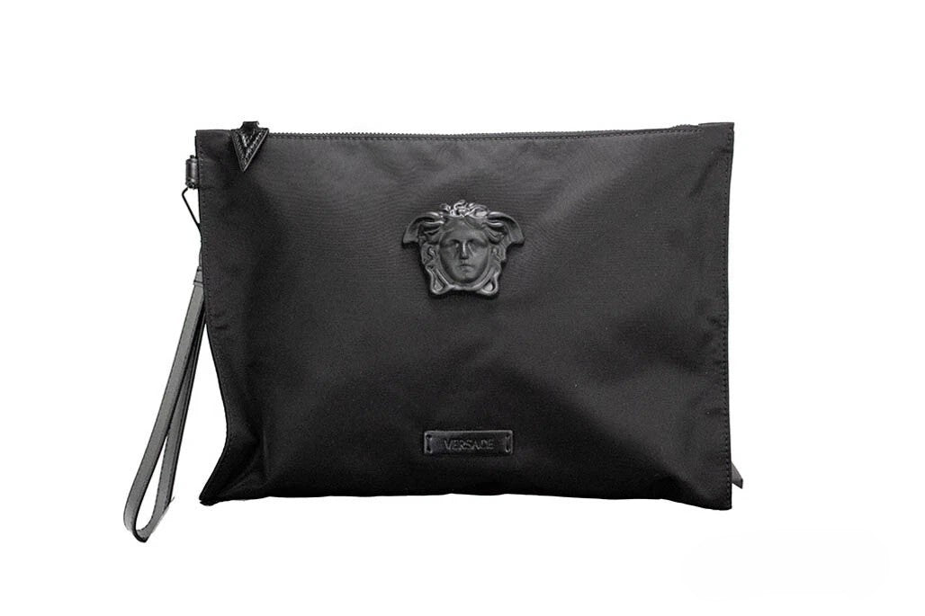 Discover the Versace Large Black Nylon Fabric Medusa Convertible Pouch, a masterpiece of elegance and versatility, perfect for the discerning individual seeking sophistication.