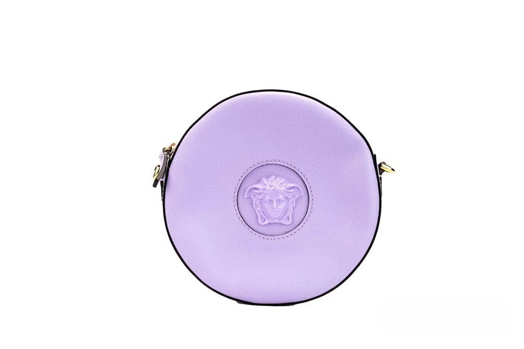 Indulge in the Versace Round Disco Lilac Pebbled Leather Camera Case, a masterpiece of Italian craftsmanship that seamlessly blends elegance and functionality for the discerning individual.