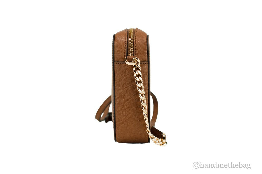 Elevate your style with the Michael Kors Saffiano Leather Crossbody Bag, a luxurious blend of exquisite craftsmanship and timeless elegance, perfect for any occasion.