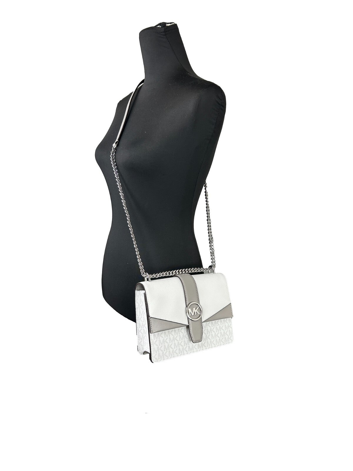 Elevate your style with the Michael Kors Greenwich Small Flap Shoulder Crossbody Bag, crafted from premium leather for timeless elegance and effortless sophistication.