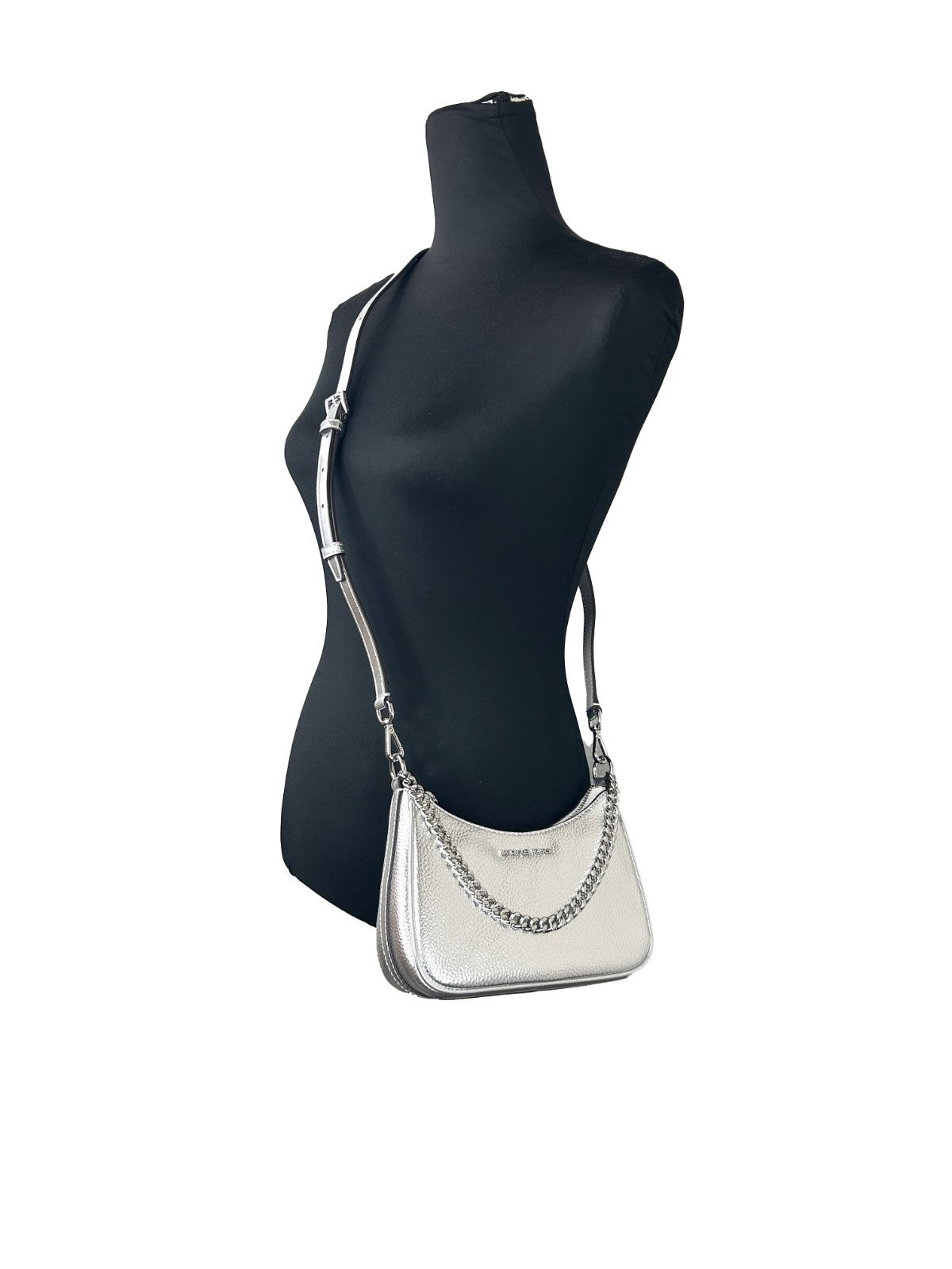 Discover the Michael Kors Small Pouchette Crossbody Bag, a masterpiece of craftsmanship and premium materials that elevates your style with timeless elegance.
