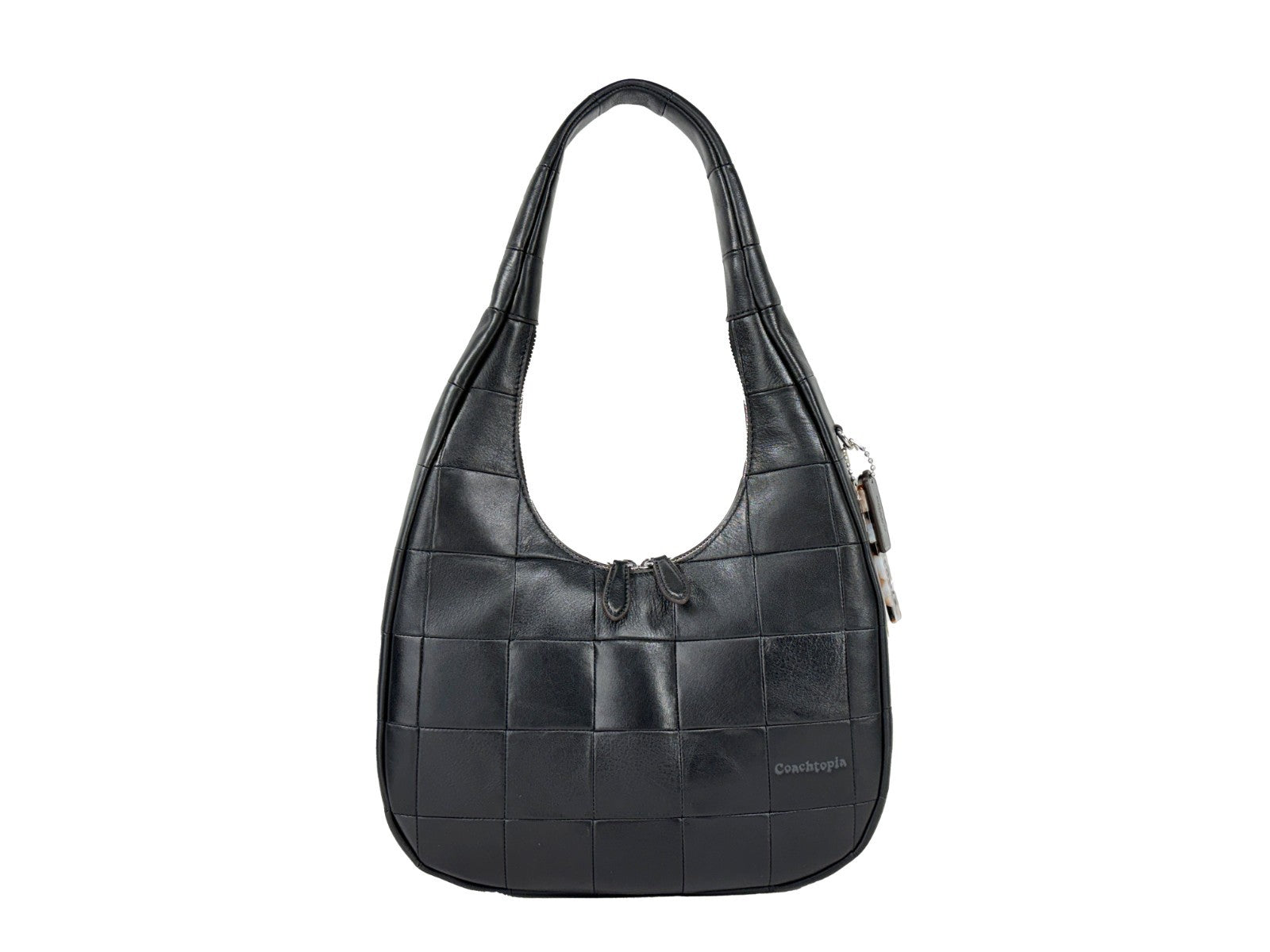 Discover the Coach Coachtopia Alter Ego Crescent Shoulder Bag, a masterpiece of upcrafted leather and silver-tone hardware, embodying timeless elegance and refined sophistication.