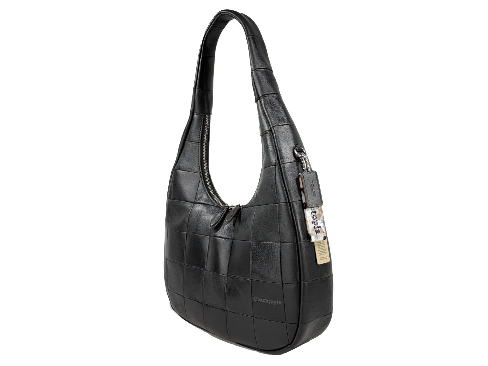 Discover the Coach Coachtopia Alter Ego Crescent Shoulder Bag, a masterpiece of upcrafted leather and silver-tone hardware, embodying timeless elegance and sophistication.