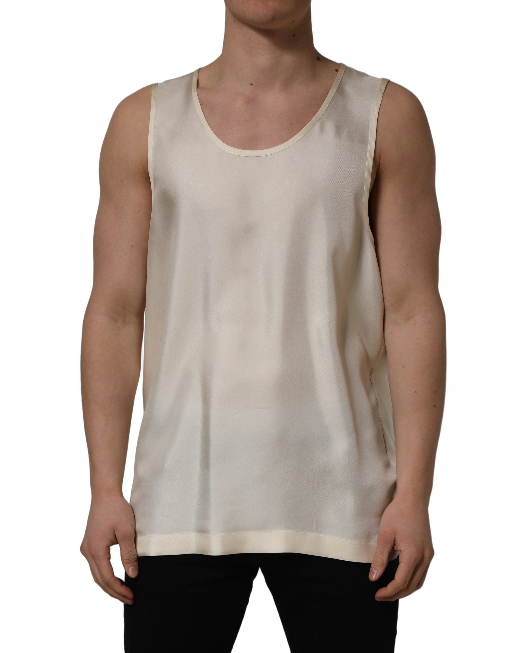 Elevate your wardrobe with Dolce & Gabbana's off-white silk sleeveless tank, a masterpiece of Italian craftsmanship that embodies timeless elegance and sophisticated allure.