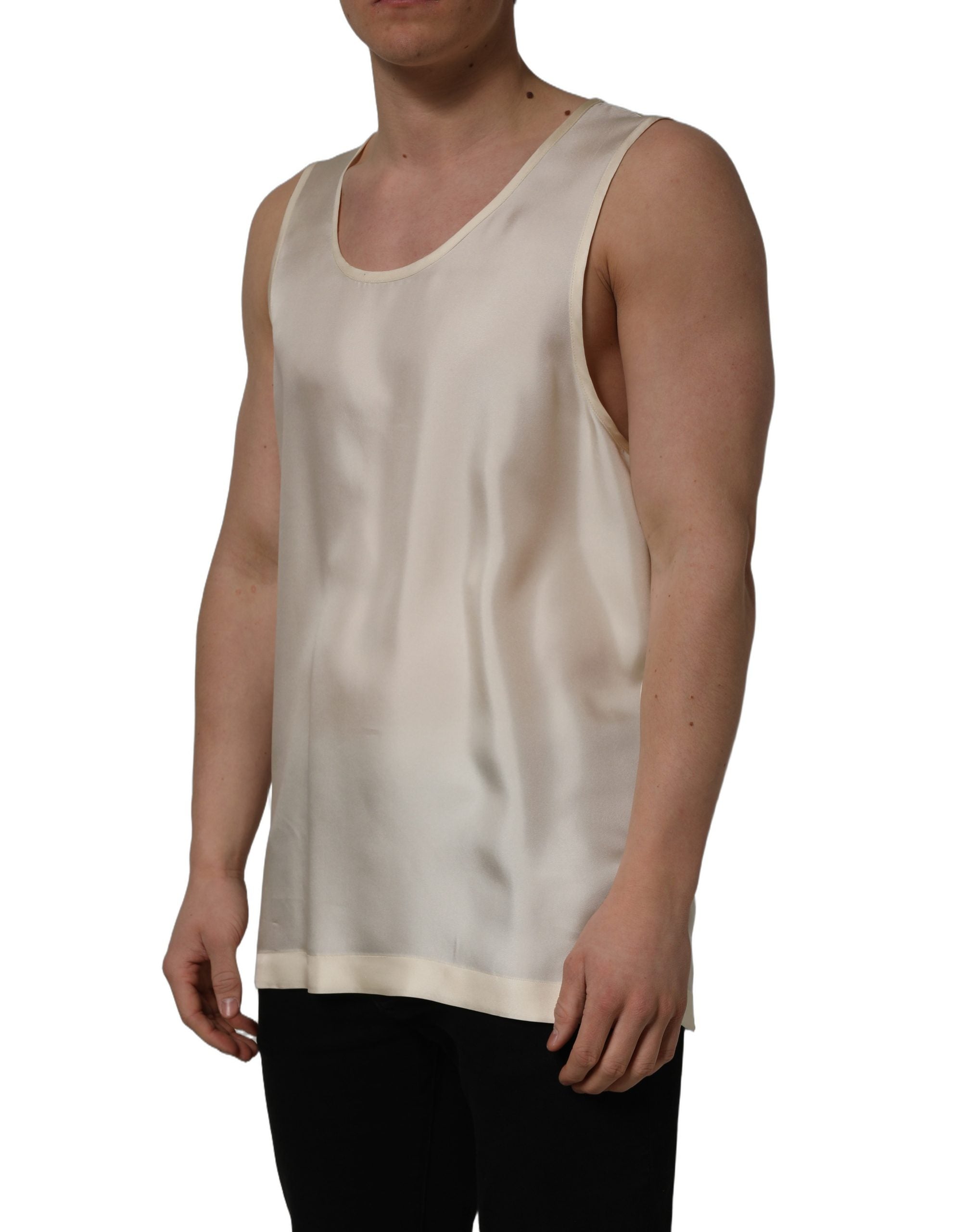 Elevate your wardrobe with Dolce & Gabbana's off-white silk sleeveless tank top, a timeless piece reflecting exquisite Italian craftsmanship and luxurious elegance.