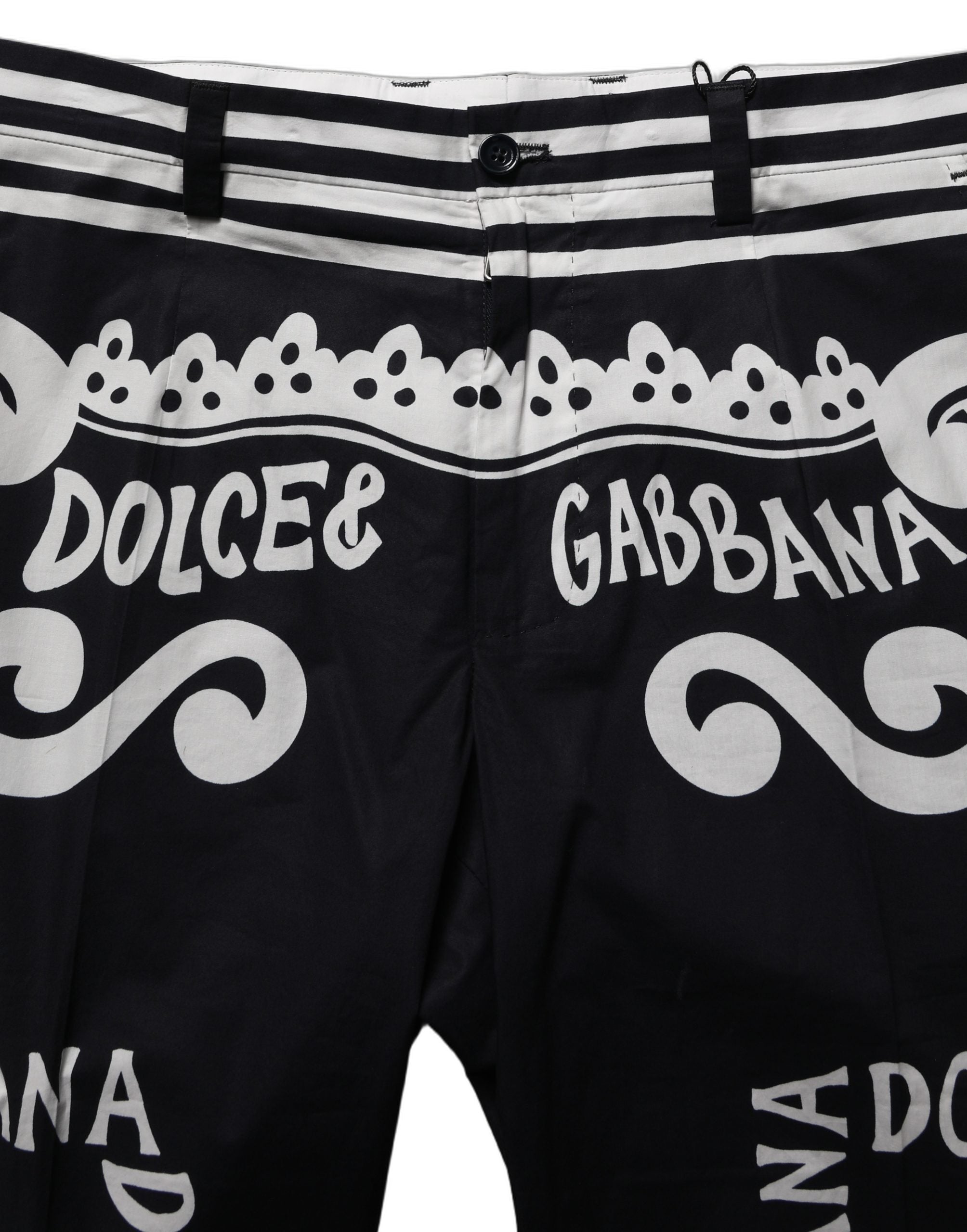 Indulge in the exquisite Dolce & Gabbana Black Cotton Poplin MarinaPrint Trouser Pants, where Italian craftsmanship meets timeless elegance for the discerning individual.