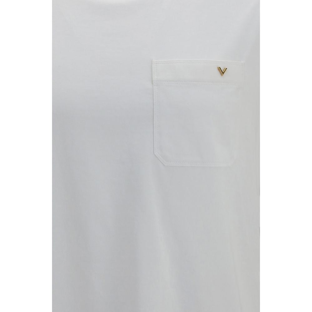 Elevate your wardrobe with the Valentino White Cotton T-Shirt, a luxurious blend of comfort and elegance, perfect for the discerning individual seeking timeless style.