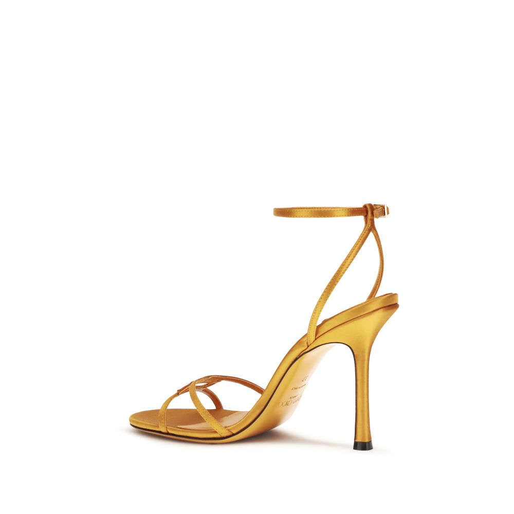 Indulge in the allure of Jimmy Choo's Orange Silk Stiletto Heel Sandals, a timeless masterpiece crafted from luxurious silk, perfect for elevating any sophisticated occasion.