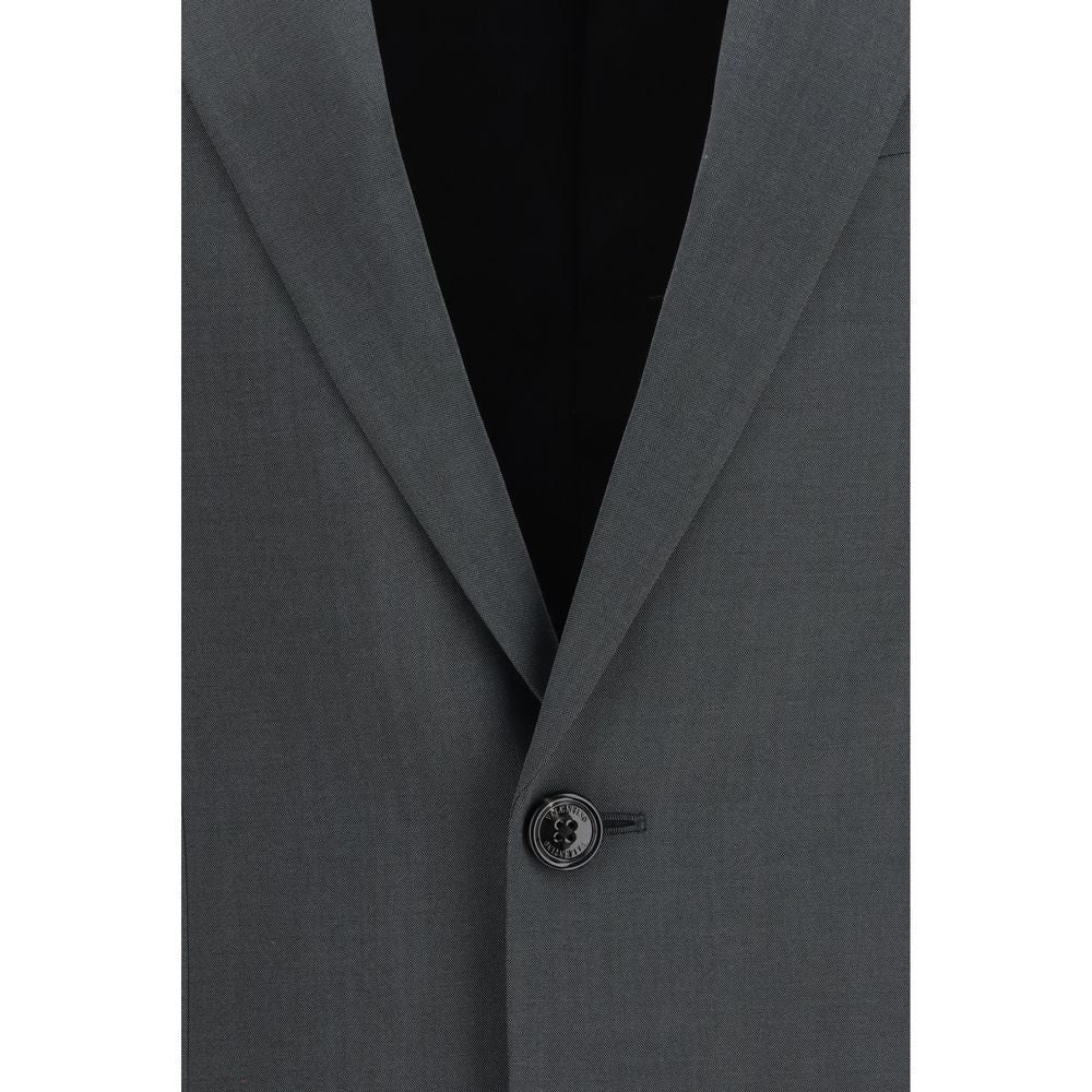 Indulge in the Valentino Gray Wool Oves Aries Jacket, a masterpiece of 84% Merino Wool and 16% Mohair, embodying timeless elegance and refined craftsmanship for the discerning connoisseur.