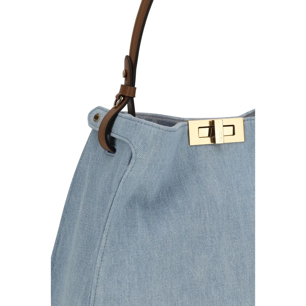 Indulge in the Fendi Blue Calf Leather Bos Taurus Shoulder Bag, a masterpiece of artisanal elegance, crafted from premium leather for the discerning individual.