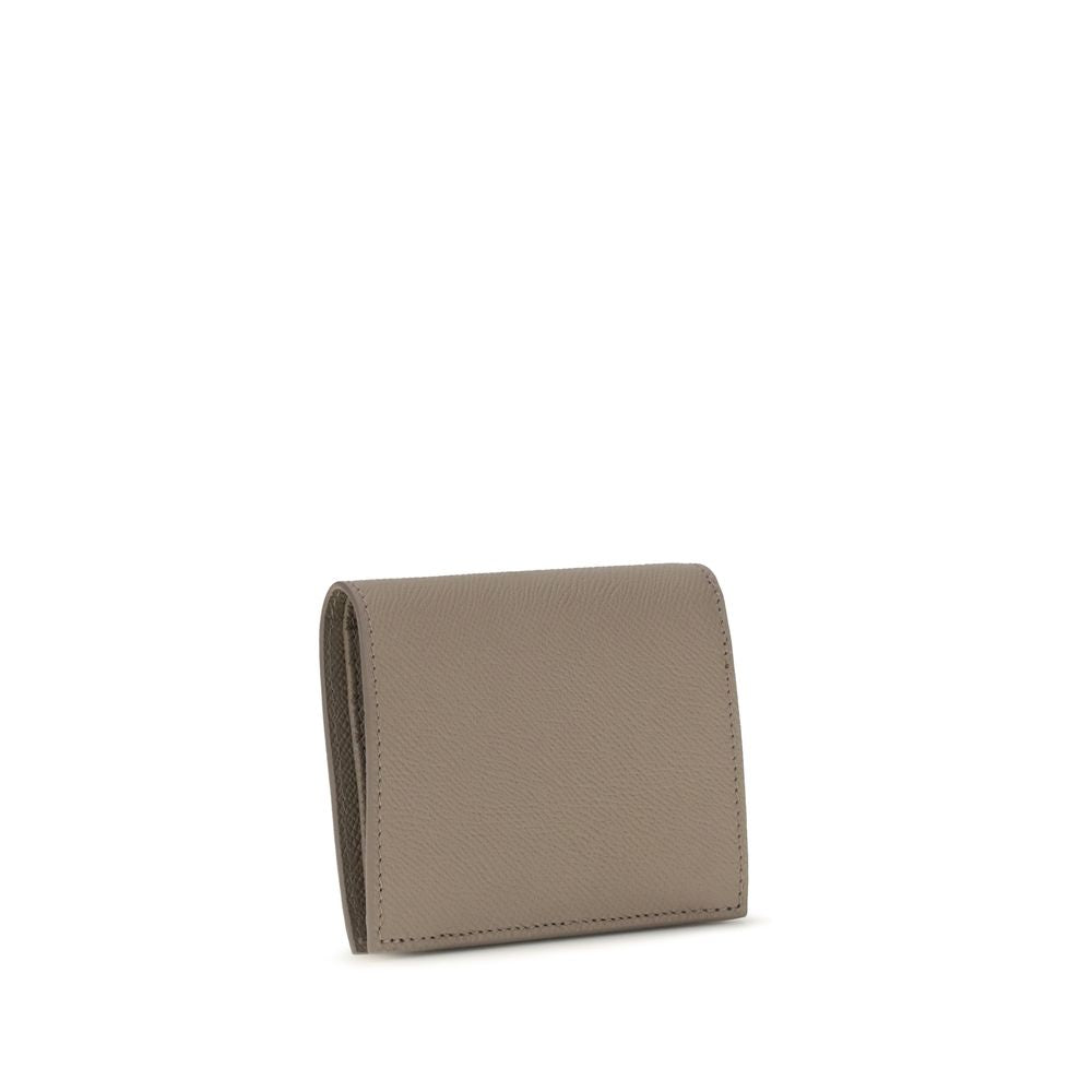 Experience the allure of the Ferragamo Beige Calf Leather Bos Taurus Shoulder Bag, a masterpiece of exquisite craftsmanship and timeless elegance, perfect for the discerning individual.