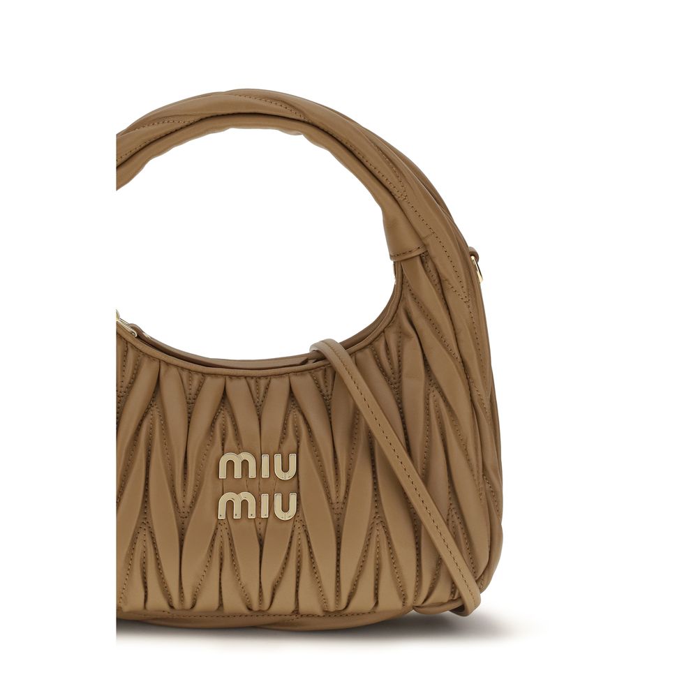 Elevate your style with the Miu Miu Beige Lamb Ovis Aries Aries Shoulder Bag, a luxurious blend of exquisite craftsmanship and timeless elegance for the discerning individual.