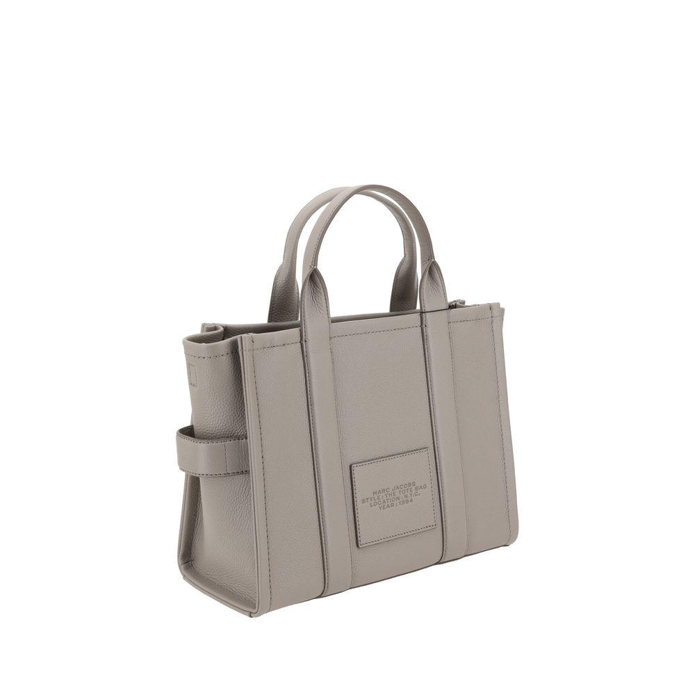Discover the Marc Jacobs Gray Calf Leather Bos Taurus Handbag, a luxurious blend of craftsmanship and elegance, perfect for the discerning individual seeking timeless style.