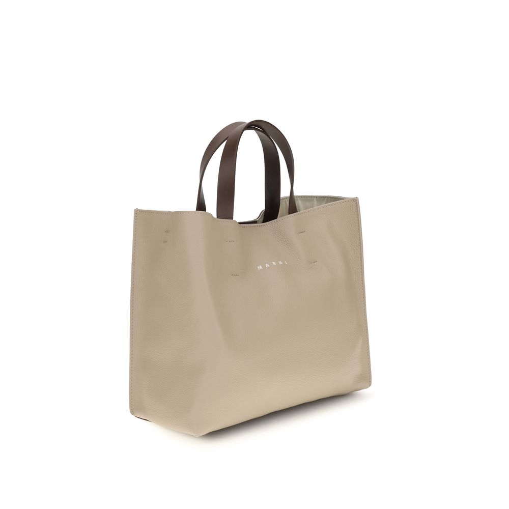 Elevate your style with the Marni Beige Calf Leather Bos Taurus Shoulder Bag, a luxurious blend of artisanal craftsmanship and minimalist elegance, perfect for discerning tastes.