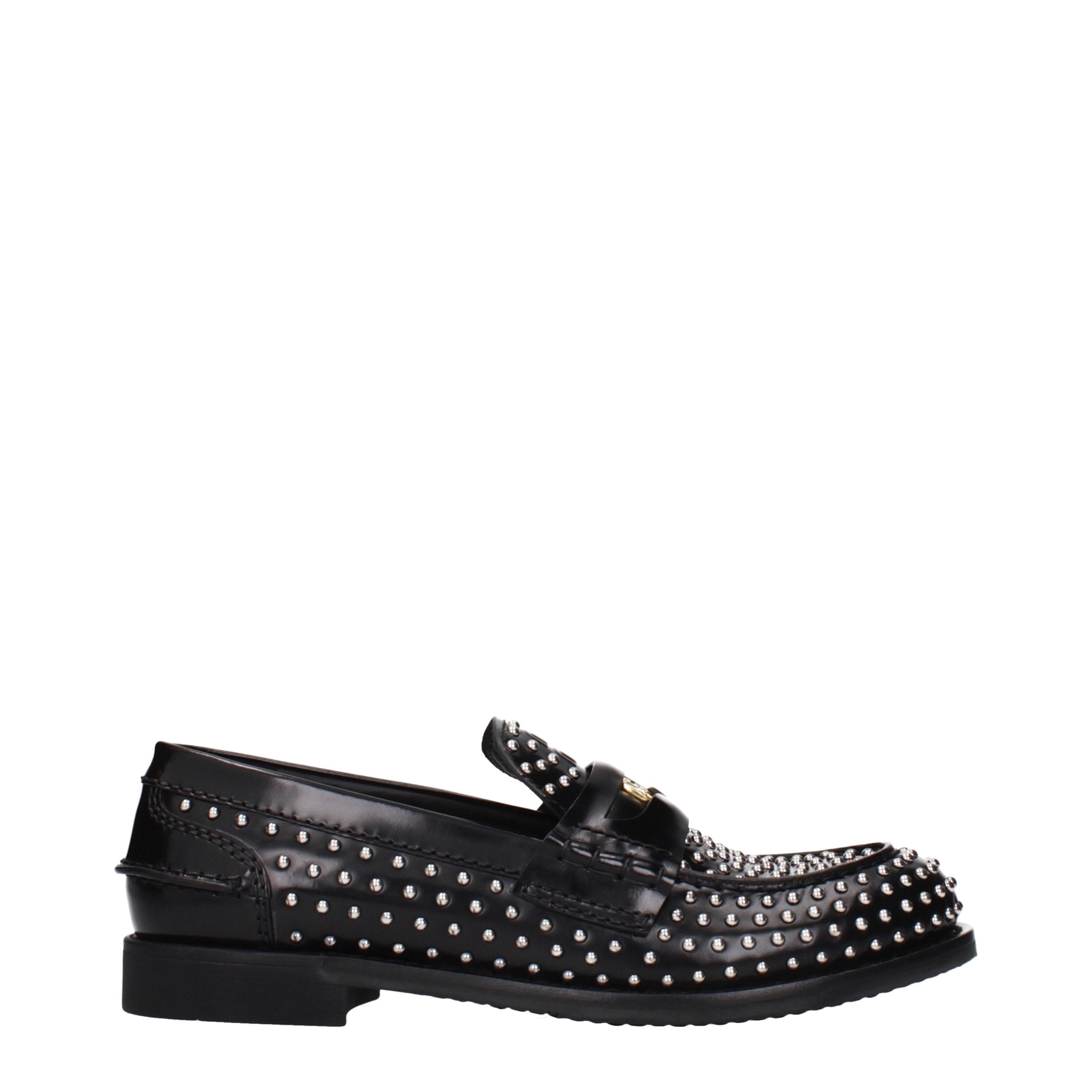 Experience the exquisite allure of Miu Miu Black Leather Slip-On Loafers, where timeless craftsmanship meets modern elegance for the discerning individual.