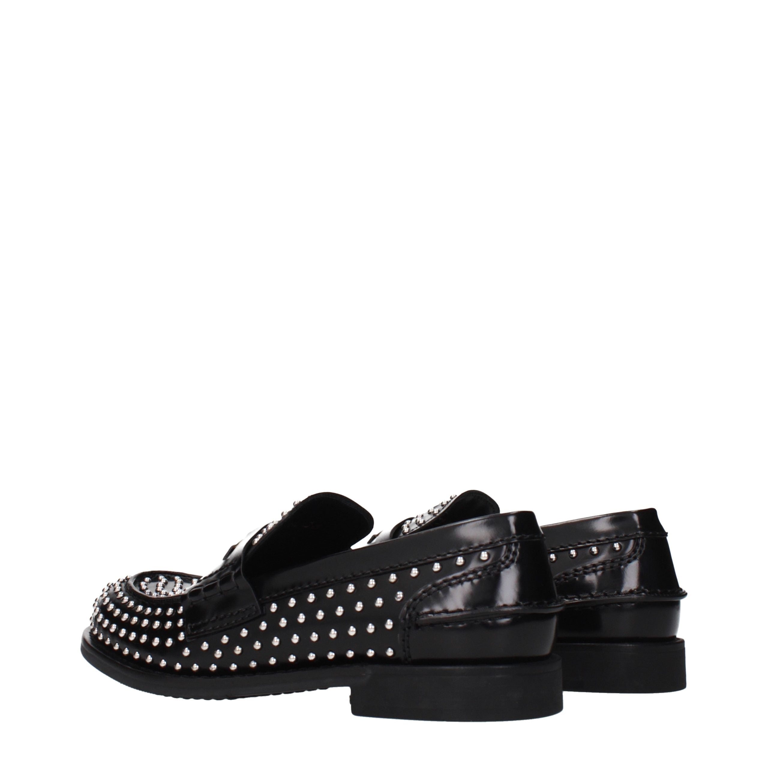 Elevate your style with Miu Miu Black Leather Slip-On Loafers, a fusion of exquisite craftsmanship and timeless elegance, perfect for the discerning individual.