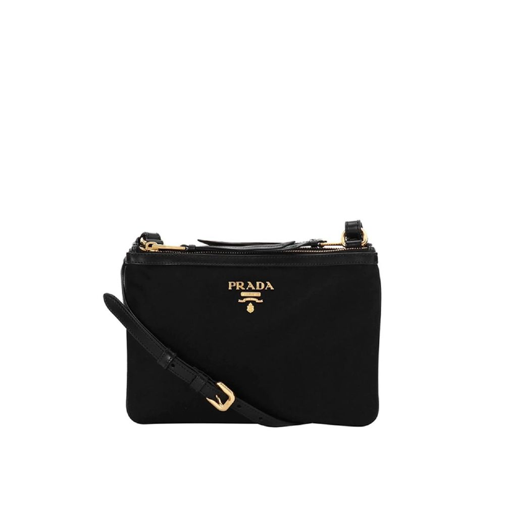 Discover the Prada Black Nylon Crossbody Bag, a symbol of luxury and artisanal craftsmanship, perfect for those who embrace elegance and sophistication in every moment.