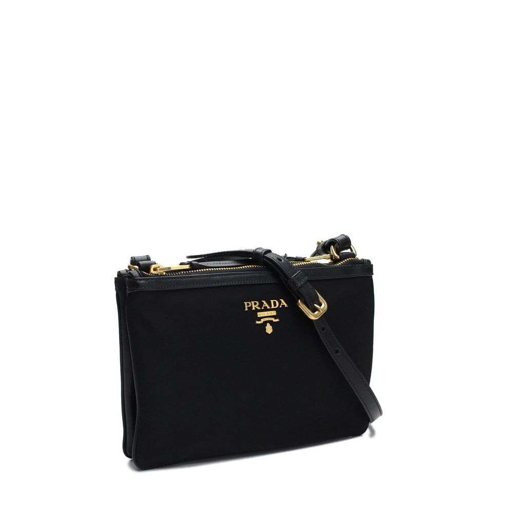 Discover the Prada Black Nylon Crossbody Bag, a blend of artisanal craftsmanship and timeless elegance, perfect for those who embrace luxury with sophistication.