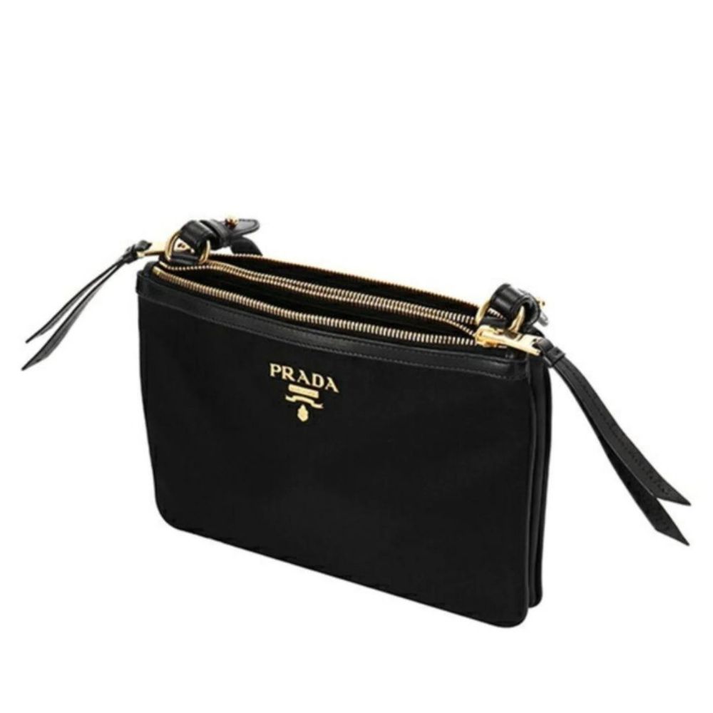 Discover the Prada Black Nylon Crossbody Bag, a symbol of luxury and sophistication, crafted from premium nylon to elevate your style with timeless elegance.