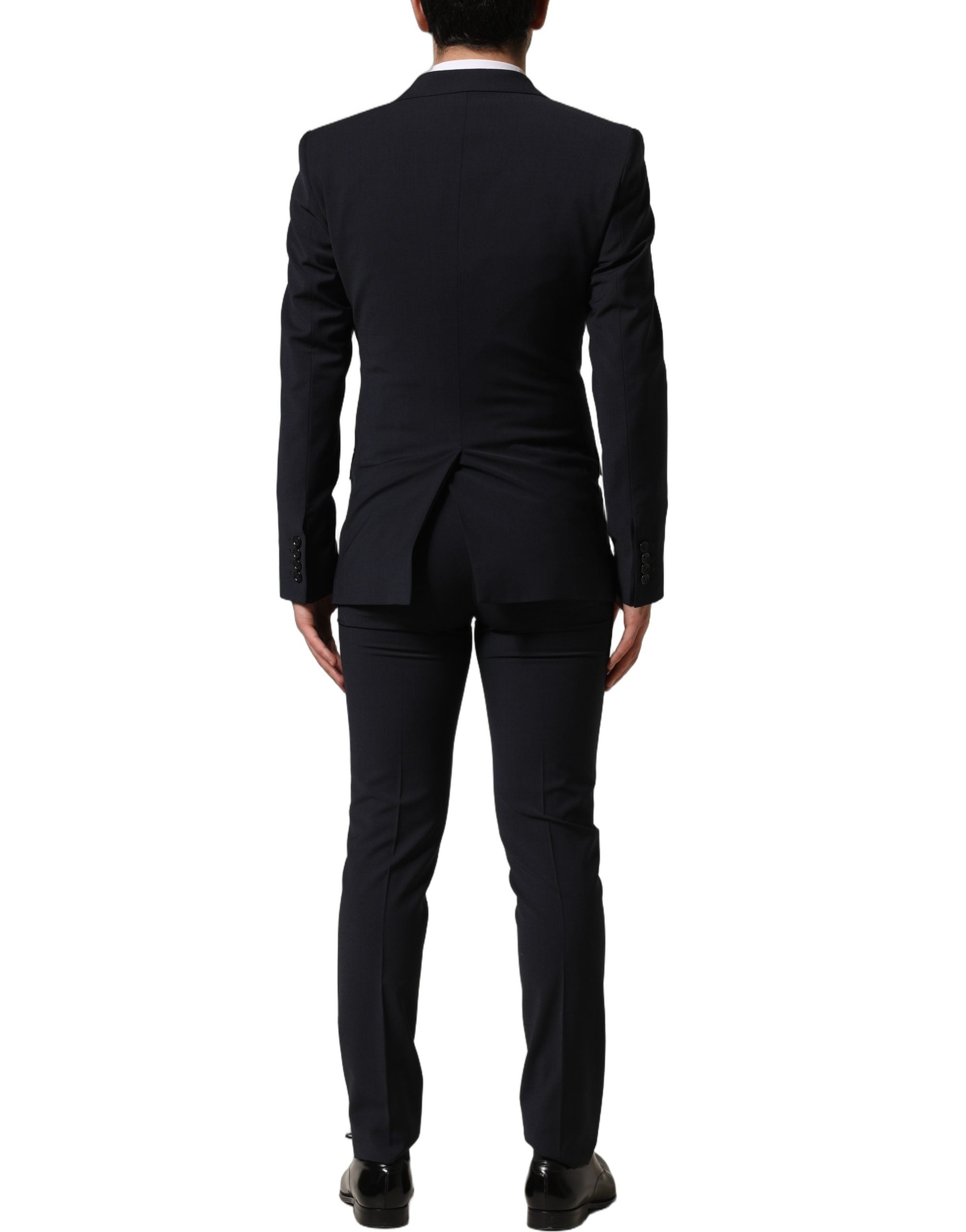 Indulge in the exquisite Dolce & Gabbana Black Wool Slim Fit Formal 3 Piece Suit, a testament to Italian craftsmanship that elevates your elegance and confidence.