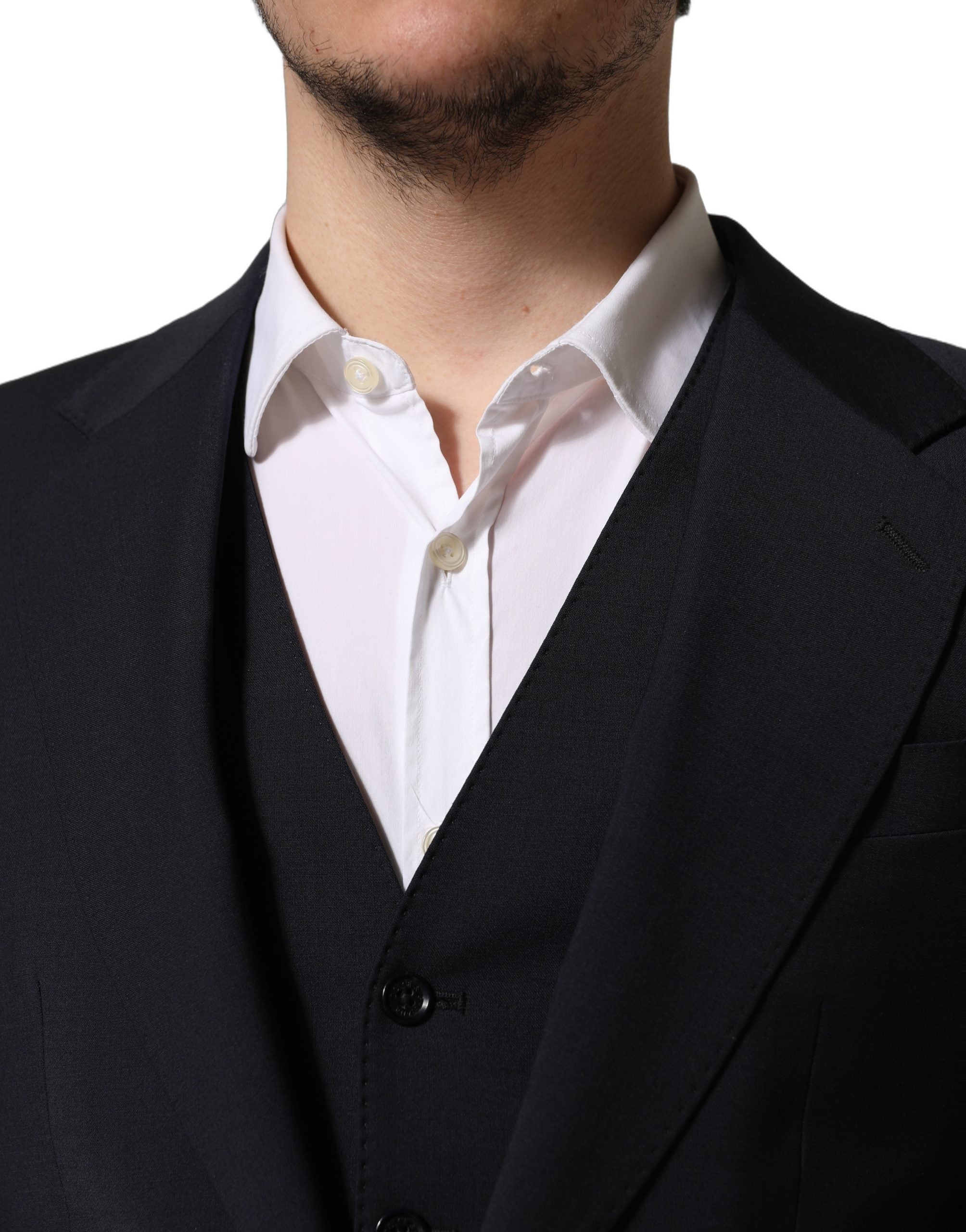 Discover the Dolce & Gabbana Black Wool Slim Fit Formal 3 Piece Suit, a testament to Italian craftsmanship, exuding timeless elegance and sophistication for the discerning individual.