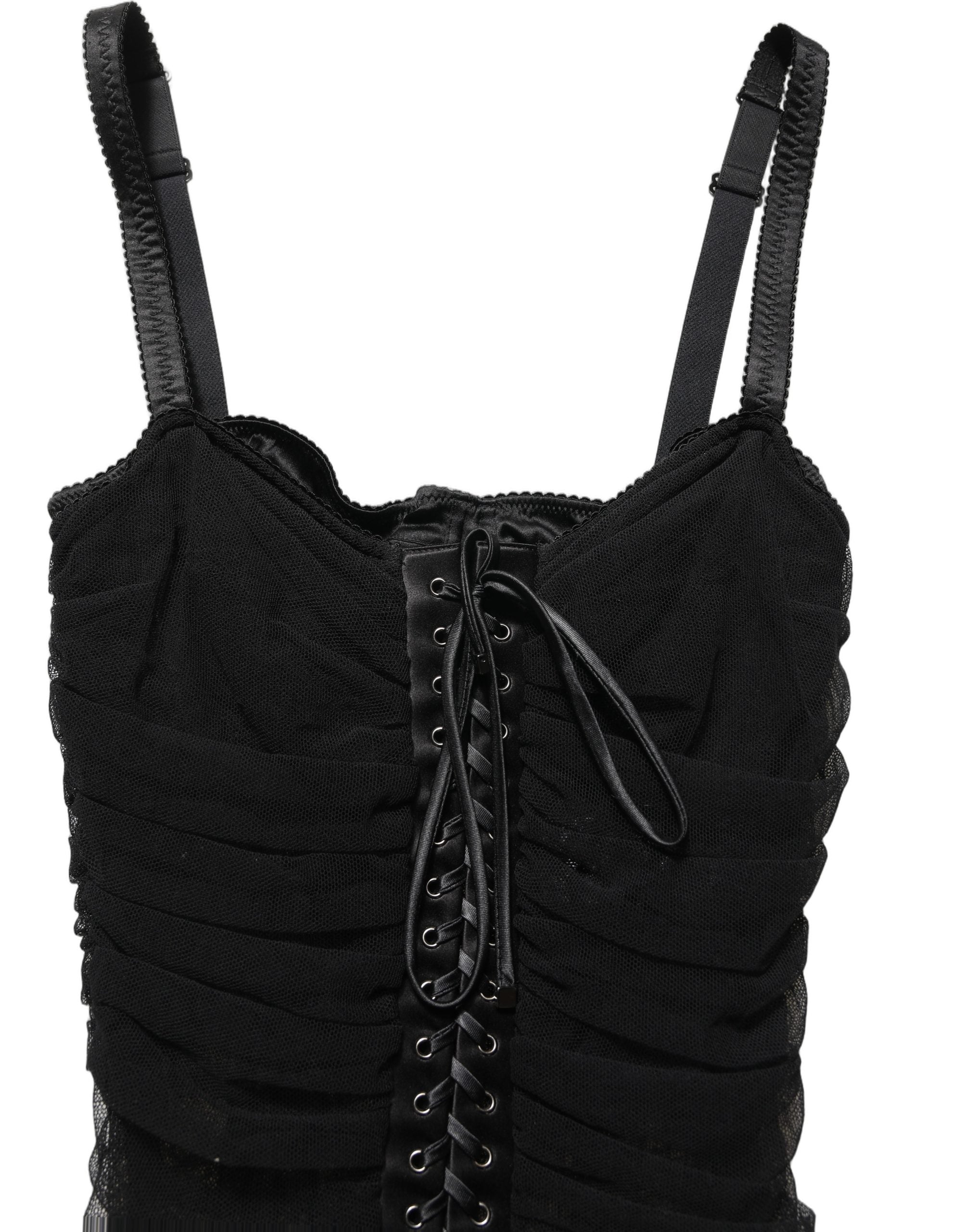Indulge in the exquisite Dolce & Gabbana Black Bodycon Corset Mini Dress, a masterpiece of luxury craftsmanship designed to elevate your allure and confidence.