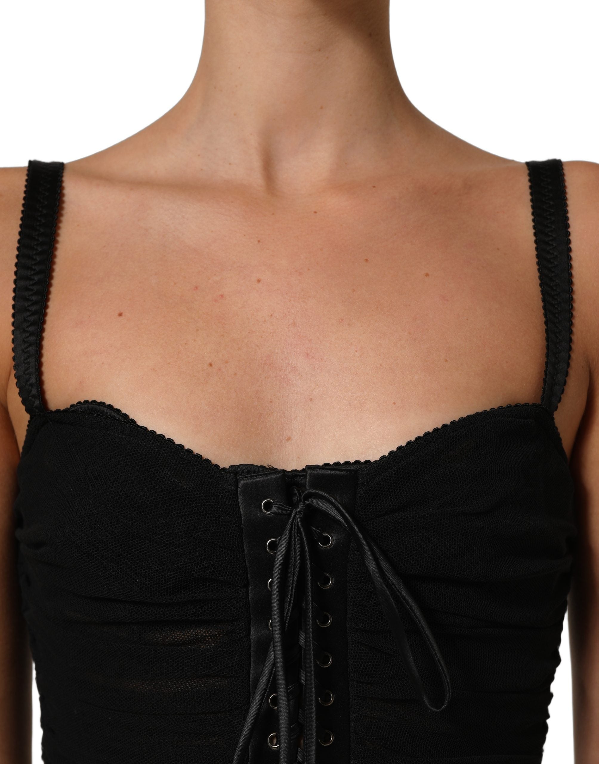 Indulge in the exquisite allure of the Dolce & Gabbana Black Bodycon Corset Mini Dress, where luxurious materials meet impeccable craftsmanship for an unforgettable statement.