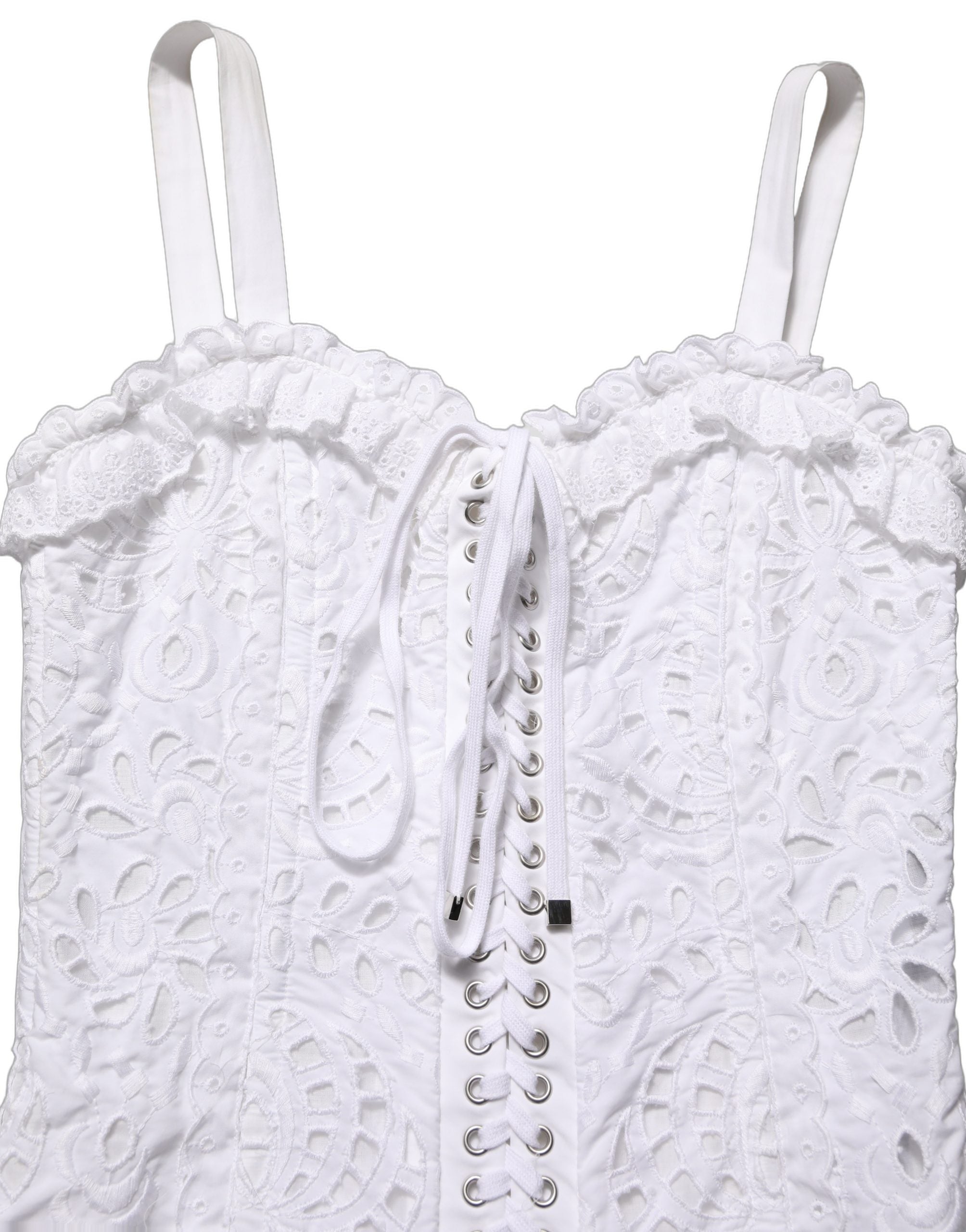 Discover the Dolce & Gabbana White Broderie Anglaise Mini Dress, a timeless piece of exquisite craftsmanship, blending luxury and elegance for unforgettable moments.