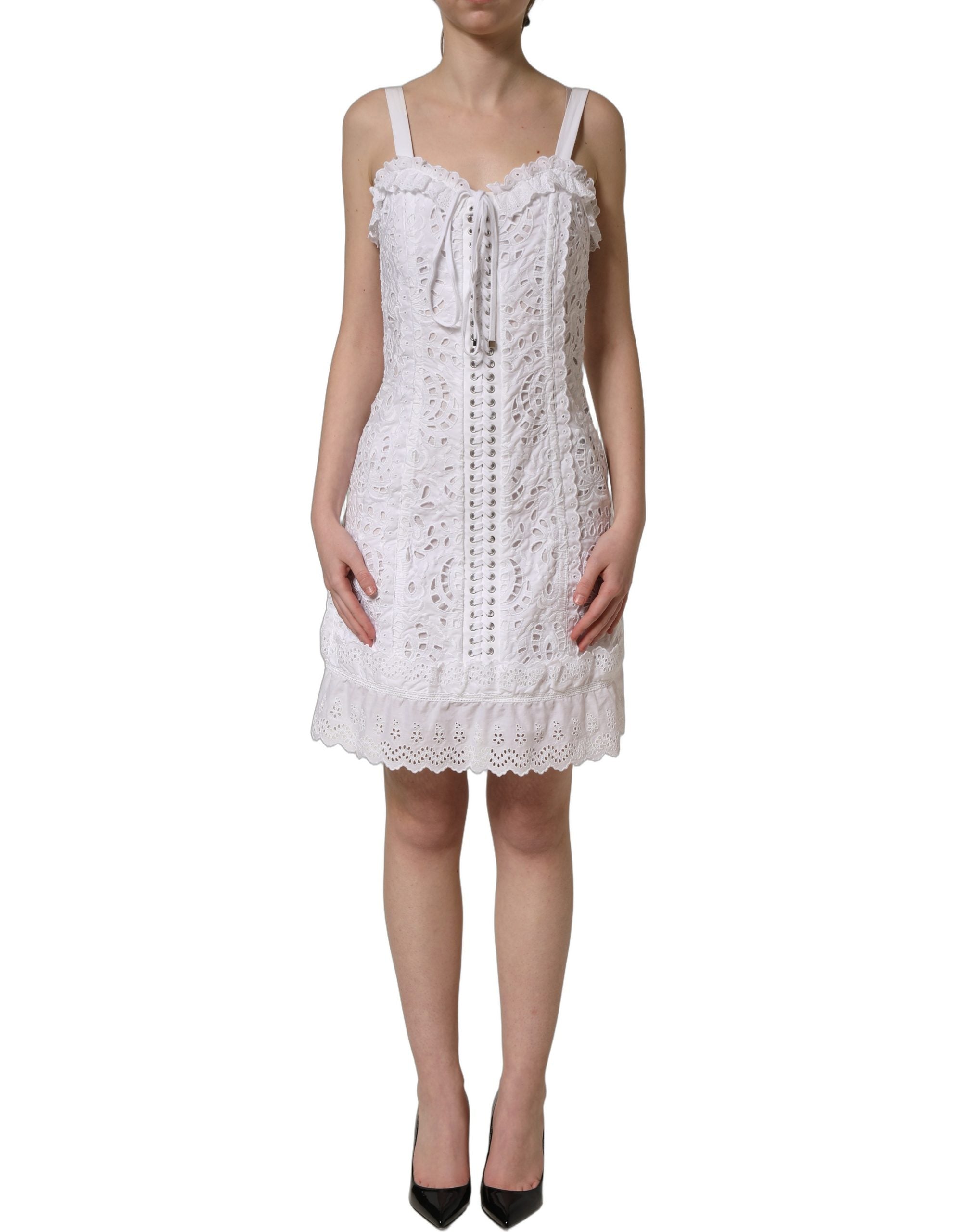 Discover the Dolce & Gabbana White Broderie Anglaise Mini Dress, a timeless masterpiece of Italian craftsmanship that embodies elegance and sophistication for any occasion.