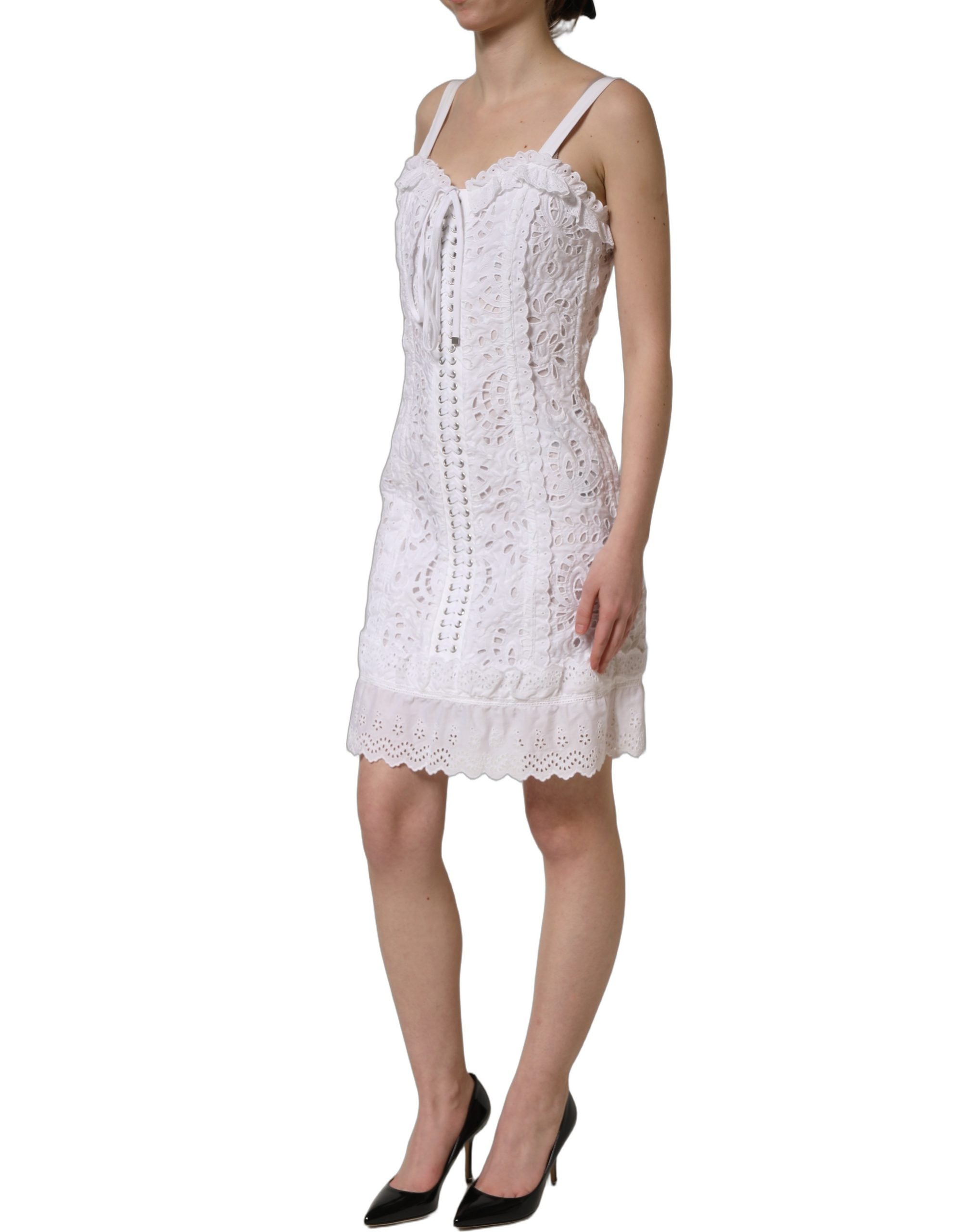 Discover the Dolce & Gabbana White Broderie Anglaise Mini Dress, a timeless piece of exquisite craftsmanship, perfect for elevating your elegance at any occasion.