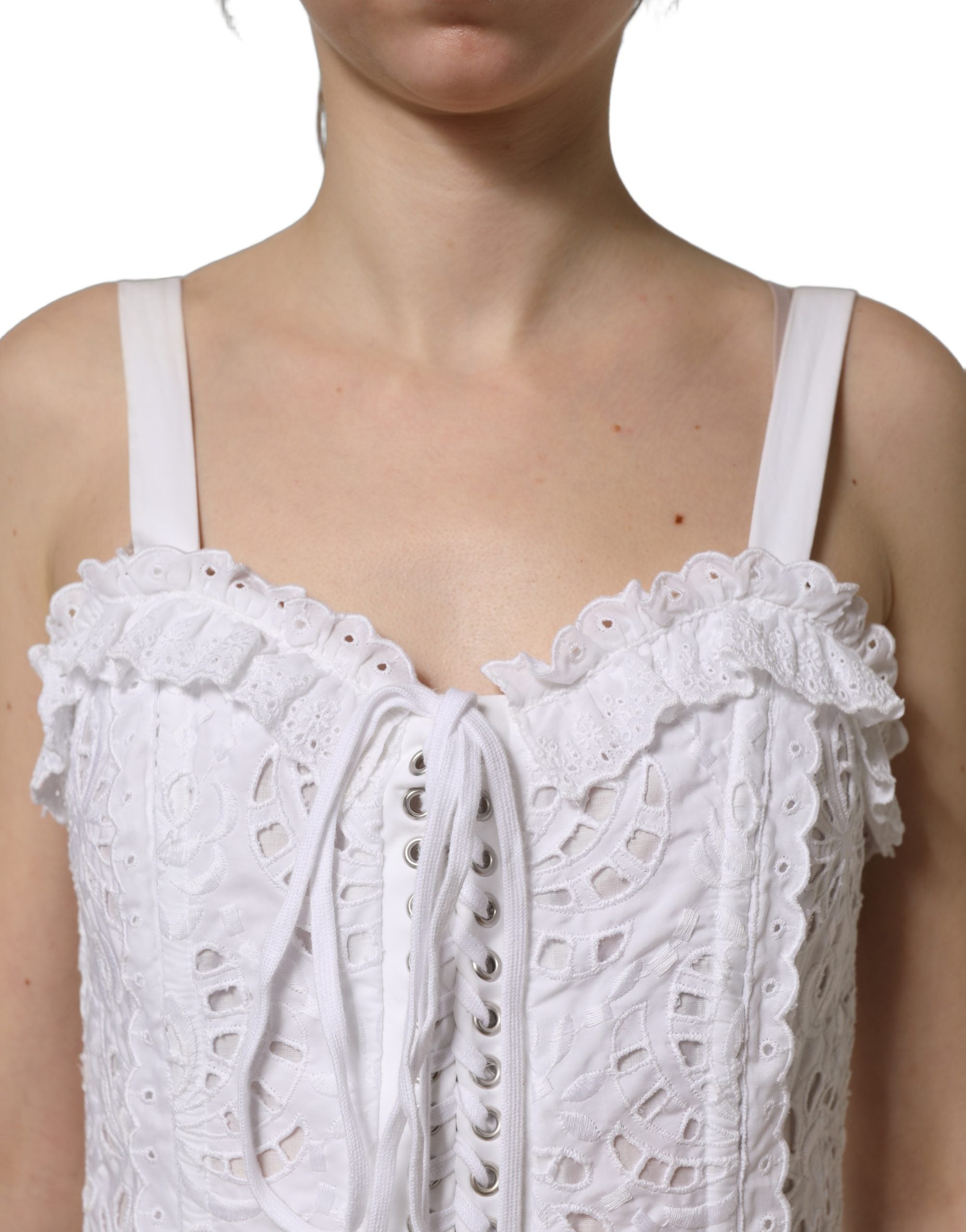 Discover the Dolce & Gabbana White Broderie Anglaise Mini Dress, a timeless masterpiece of Italian craftsmanship, perfect for elevating your elegance and allure.