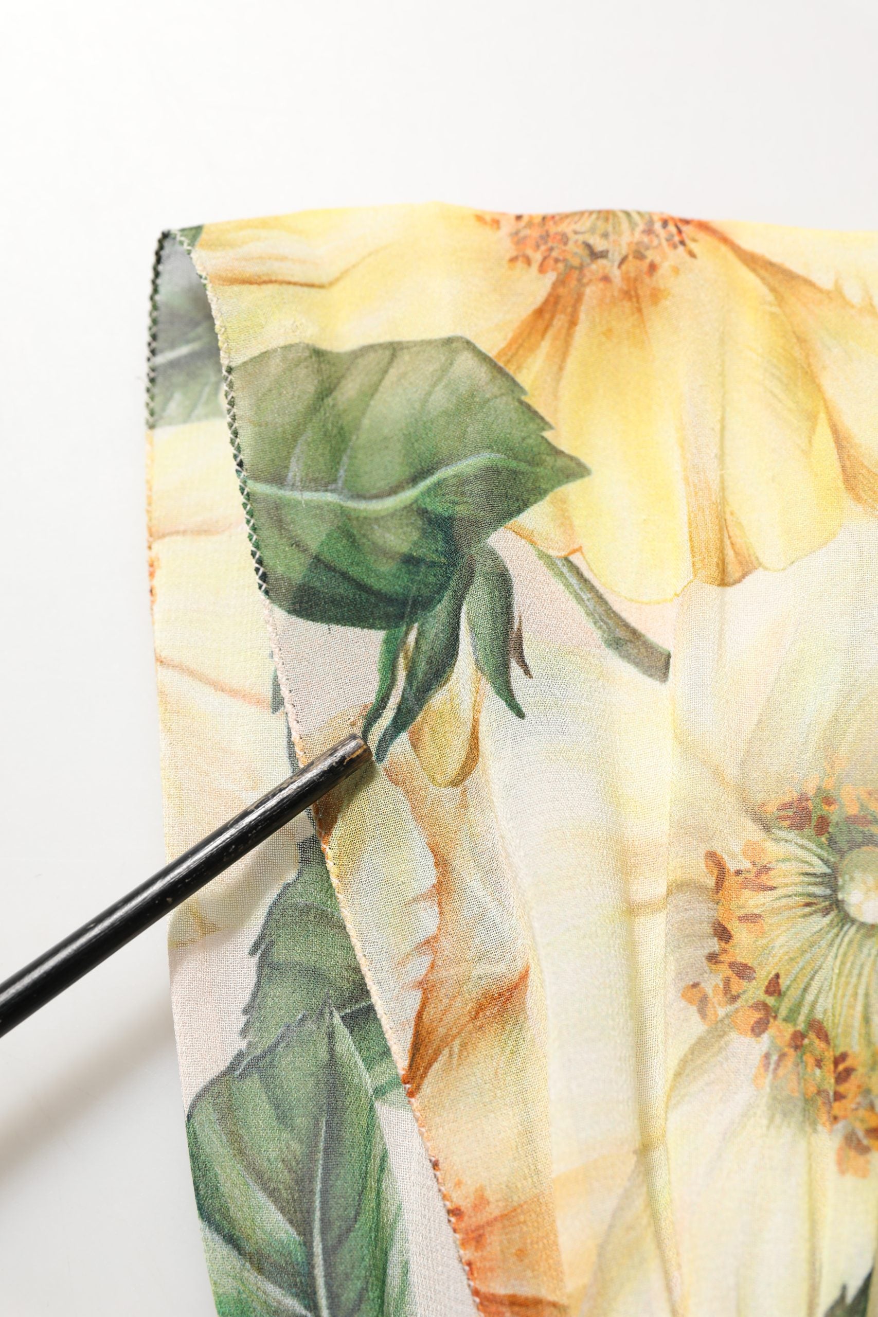 Indulge in the exquisite Dolce & Gabbana Yellow Floral Print Silk Pleated Maxi Dress, where Italian craftsmanship meets timeless elegance, perfect for any sophisticated affair.