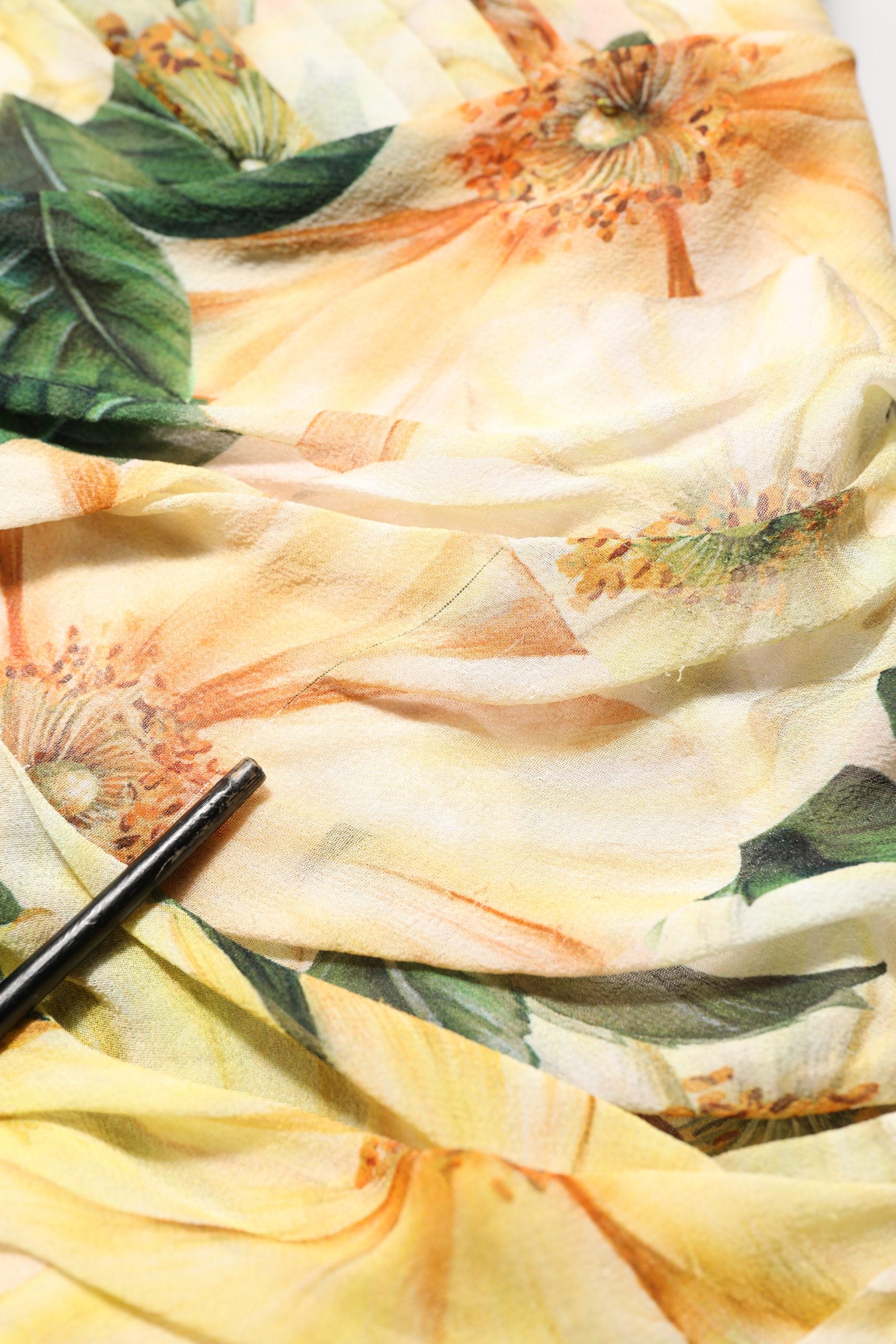 Indulge in the exquisite Dolce & Gabbana Yellow Floral Print Silk Pleated Maxi Dress, a masterpiece of Italian craftsmanship that redefines elegance for any sophisticated occasion.